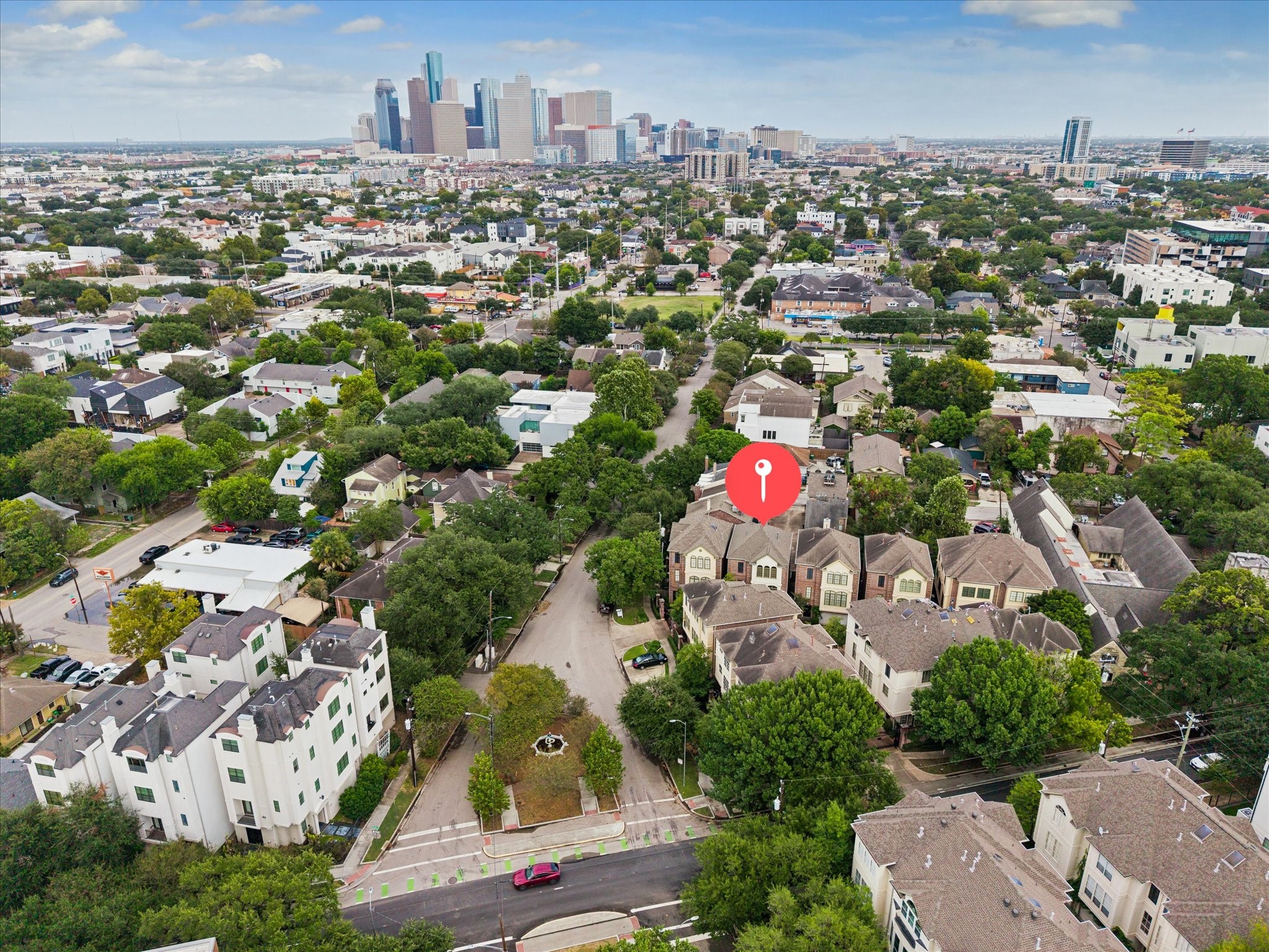 Free-standing home nestled in a vibrant Montrose neighborhood, offering easy access to downtown and surrounded by lush greenery.