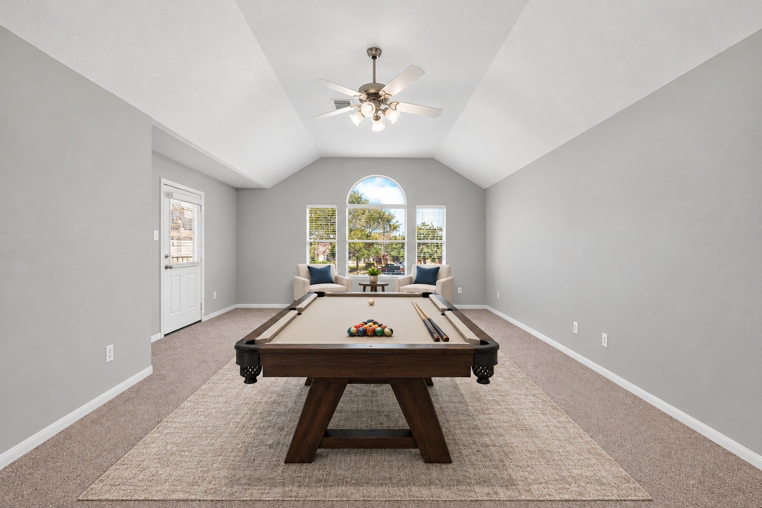 Upstairs, soft carpeted floors lead into a spacious game room designed for fun, play, and quality time together.