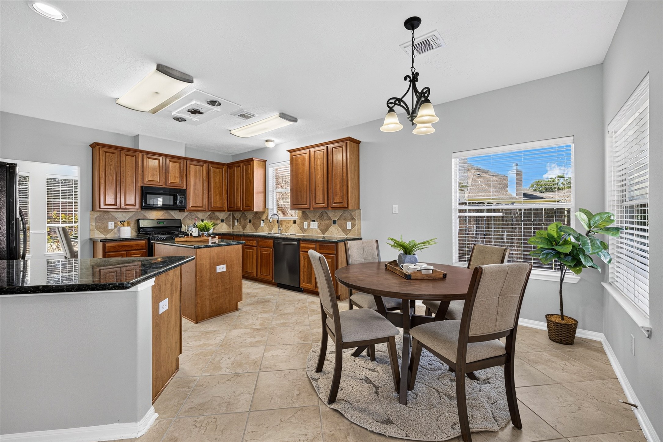 Expansive windows fill the space with warm sunshine, making it the perfect spot to savor your daily coffee and start every morning on a cheerful note.