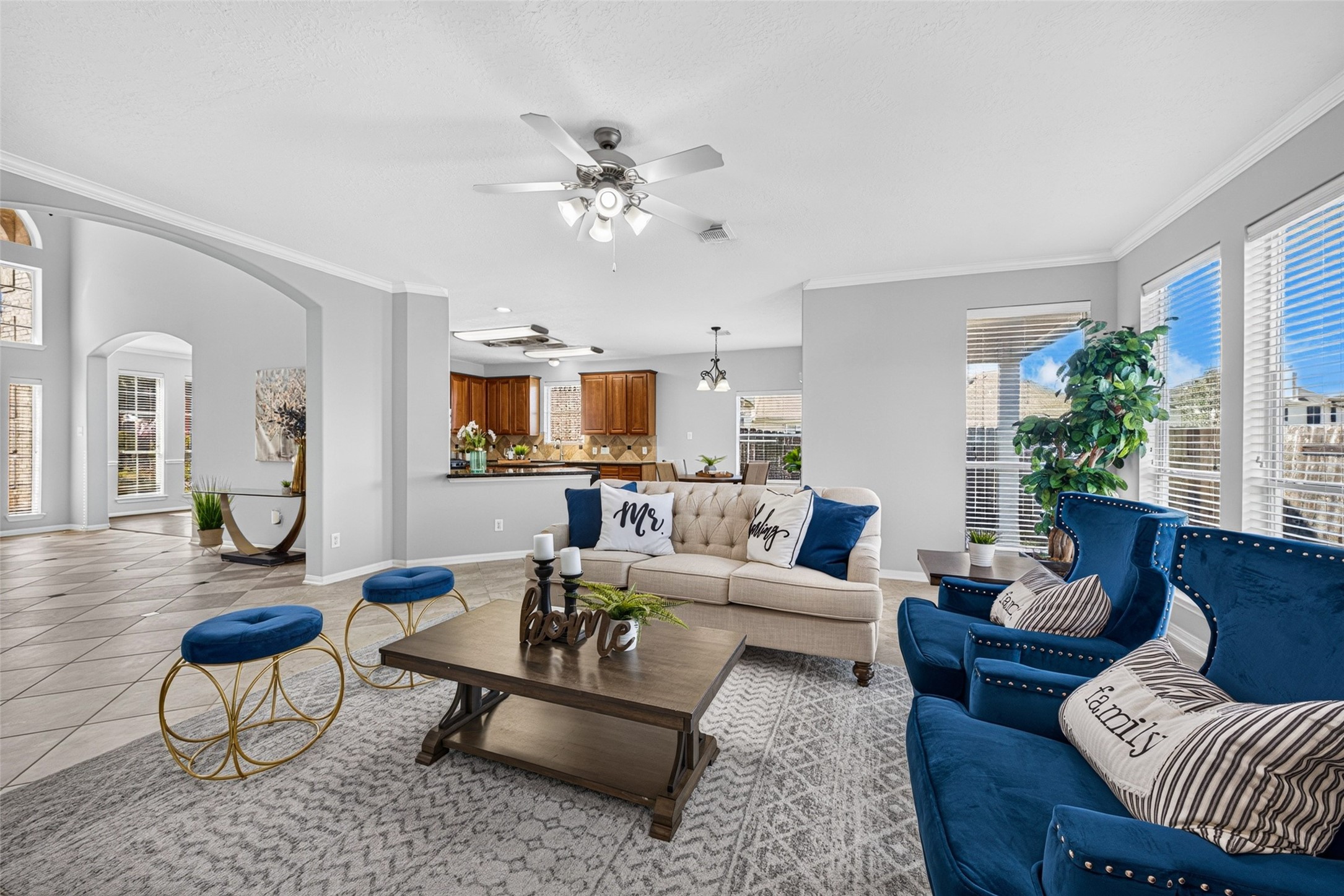 Expansive windows frame peaceful views, keeping the room bright, uplifting, and full of life throughout the day.