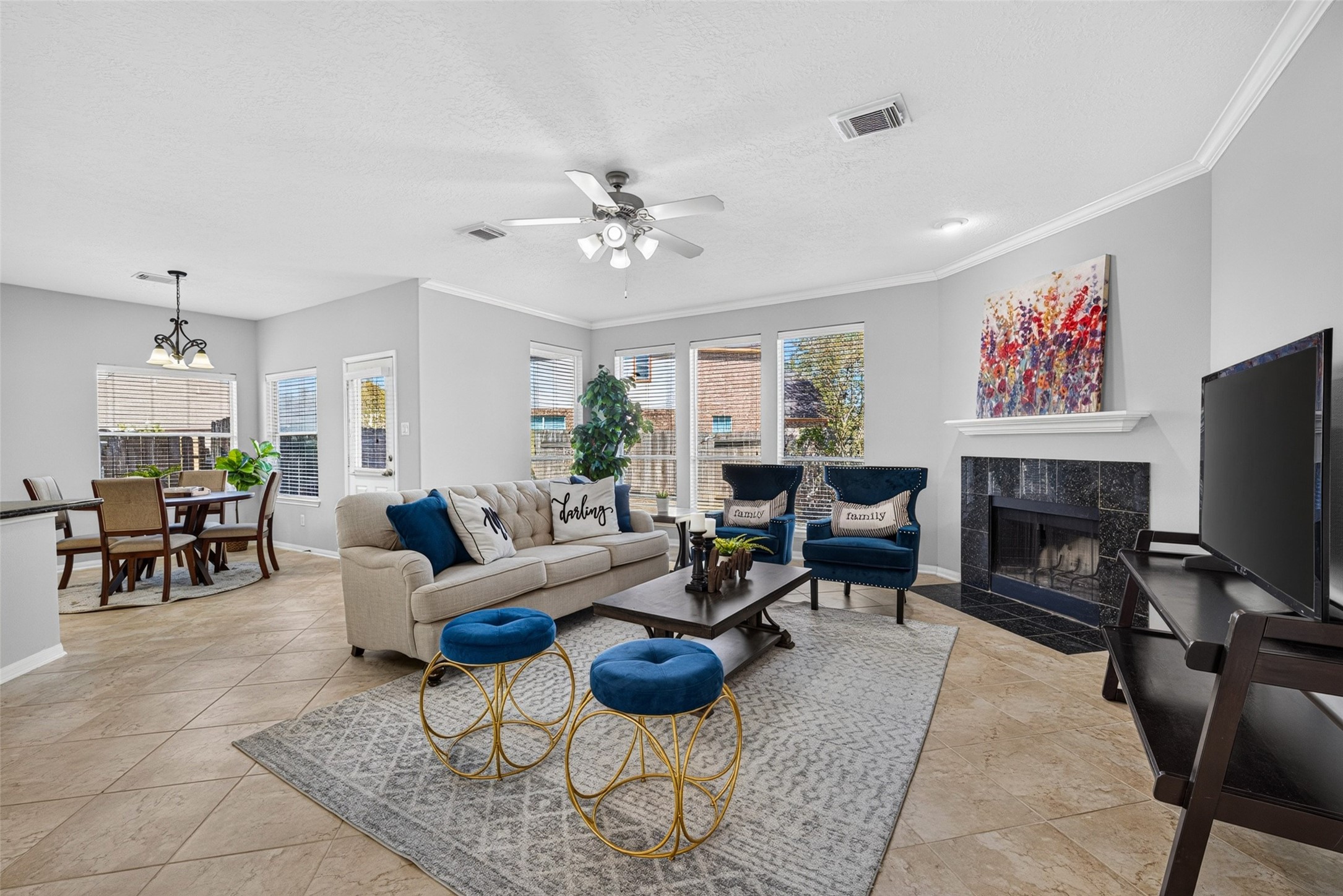 At the center of daily life sits the open-concept living room, seamlessly blending into the sunny breakfast area for easy, relaxed living.