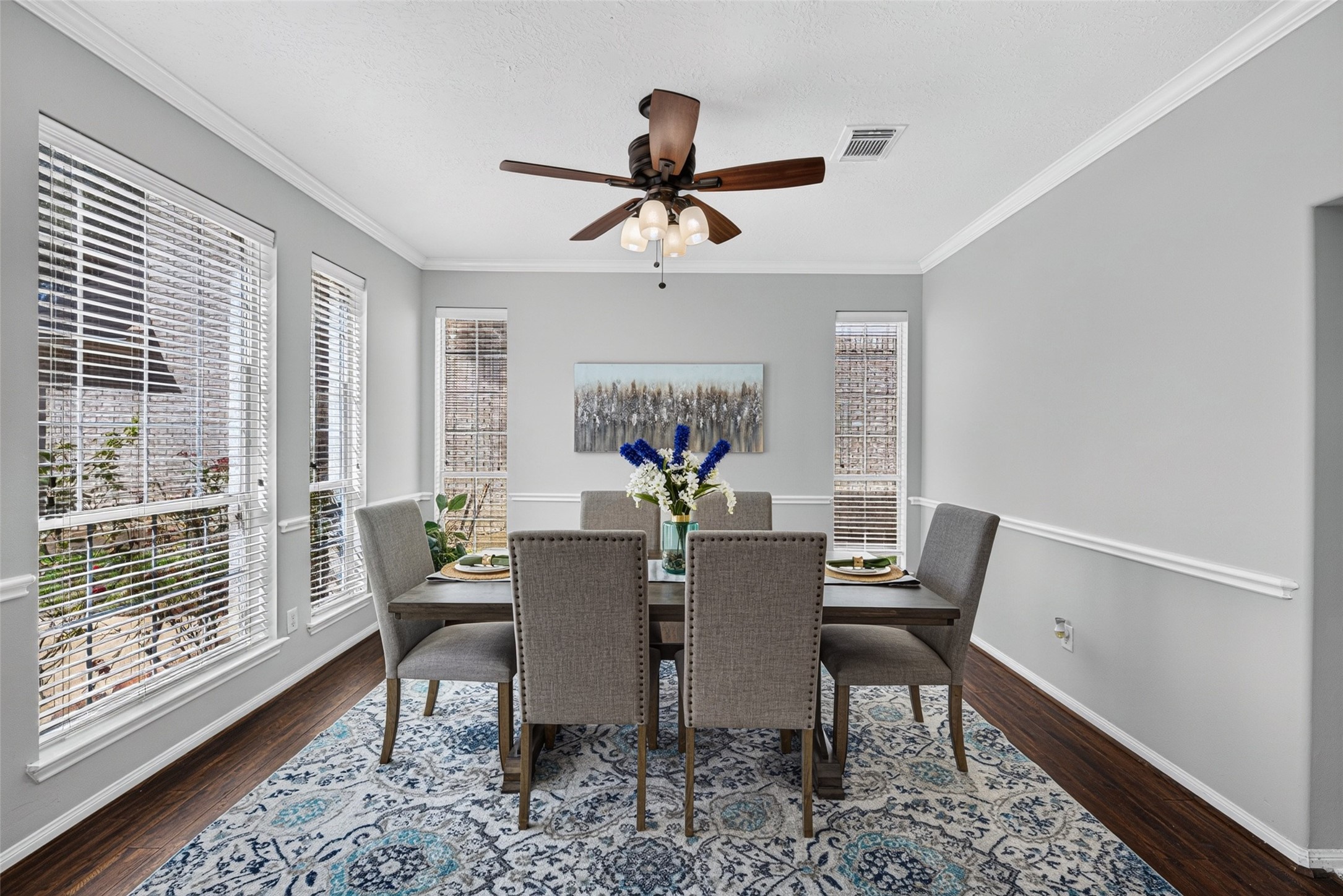 The formal dining space boasts rich, glowing wood floors that bring a cozy elegance to every meal and special occasion. The formal dining space boasts rich, glowing wood floors that bring a cozy elegance to every meal and special occasion.