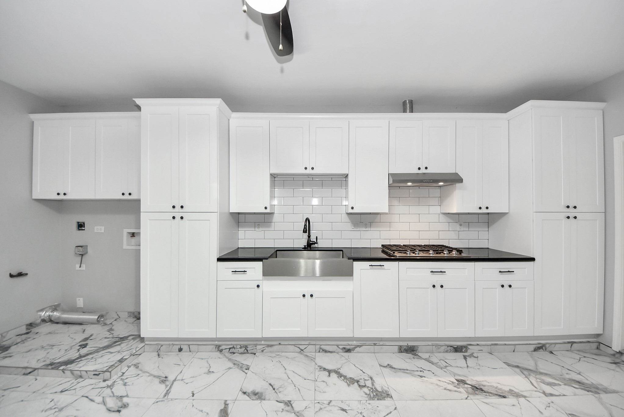 A standout feature you do not see every day  this upgraded garage combines function and flexibility with cabinetry, a sink, and a cooktop.