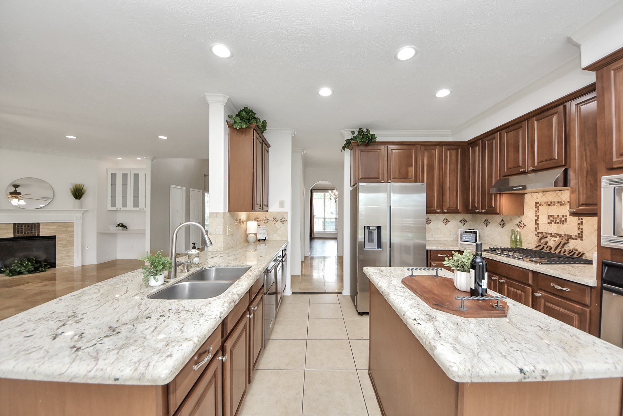 Thoughtfully designed, the kitchen offers a double sink, and a practical layout with appliances positioned for easy meal prep and entertaining.
