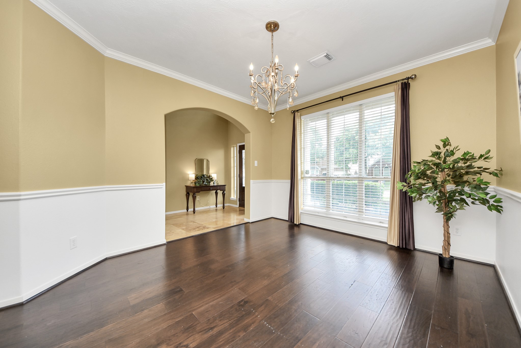Gather, celebrate, and make memories in this dedicated dining space, where classic molding details add character and create a polished feel.