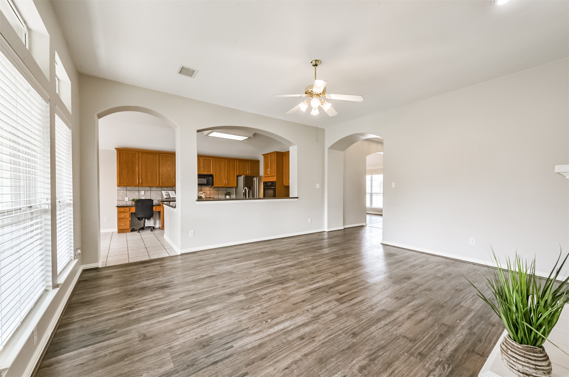 Den is open to kitchen.