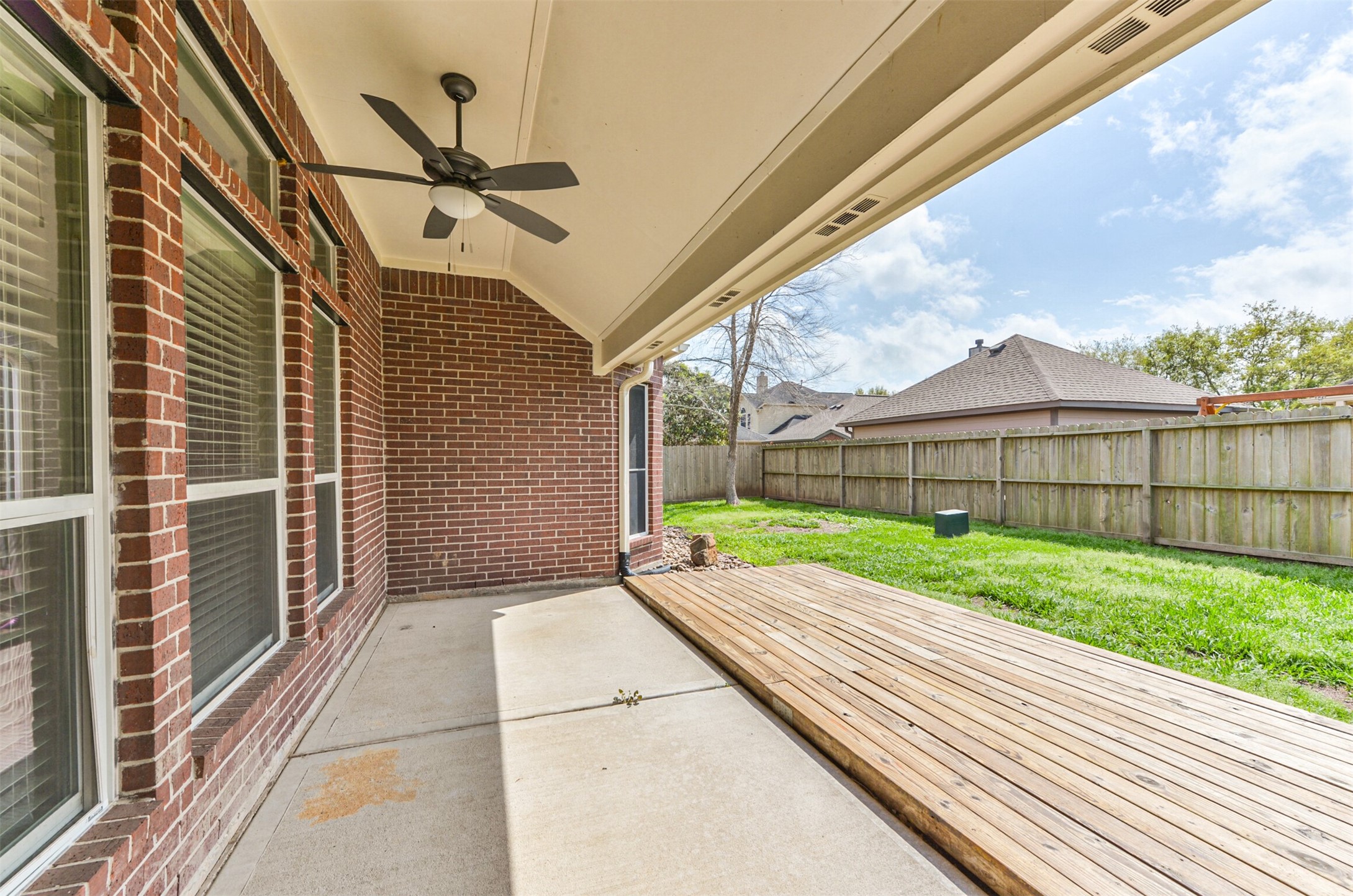 Covered patio with fan.