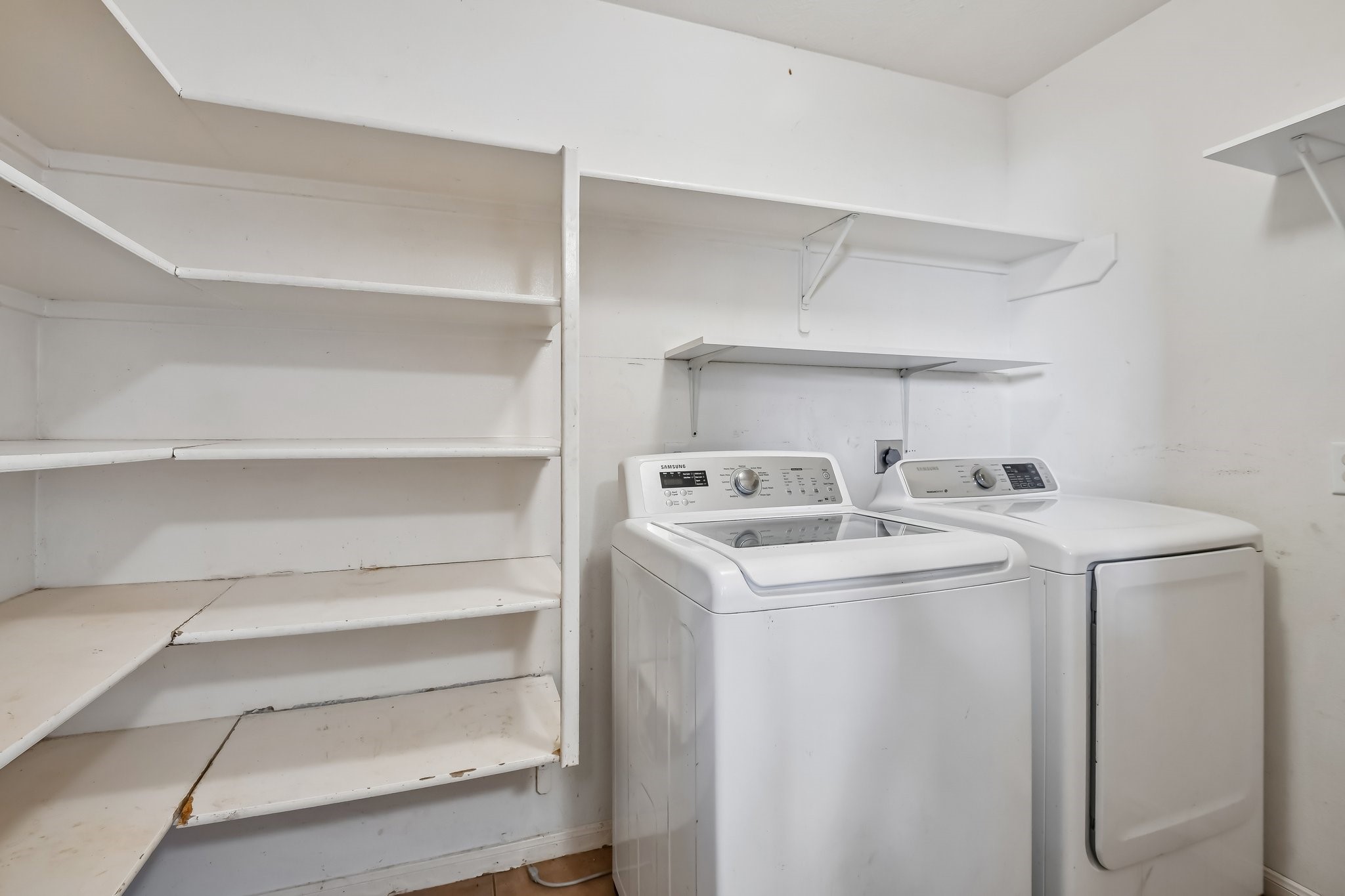 Large walk in pantry in the utility room off of the ktichen.