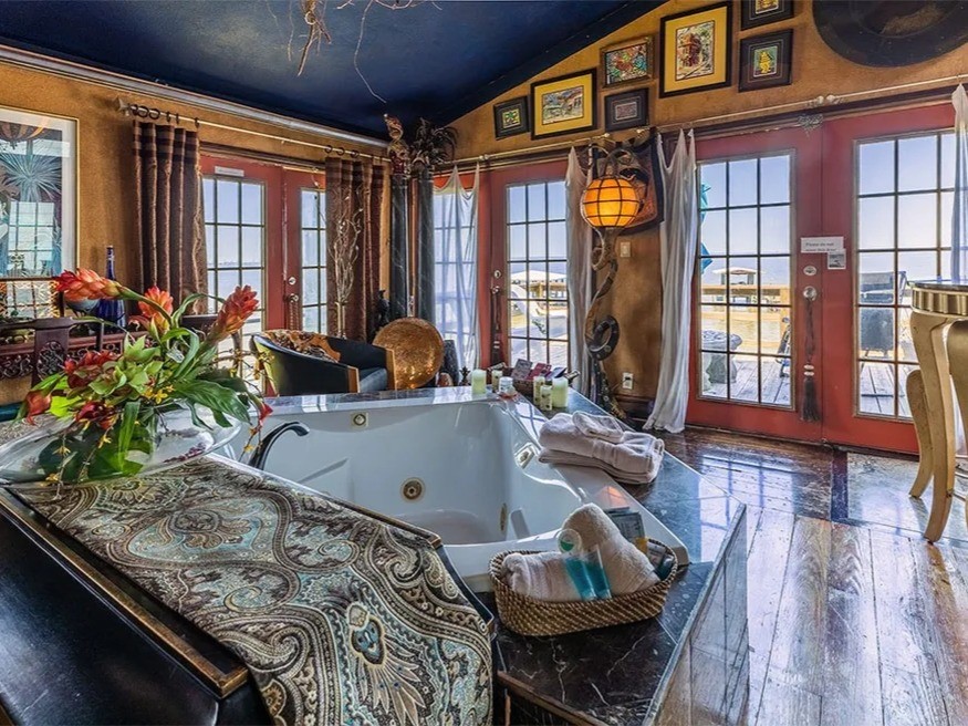 Luxurious La View retreat with stunning views. This space features elegant decor, a relaxing jacuzzi, and abundant natural light through large windows and French doors. Perfect for unwinding in style.