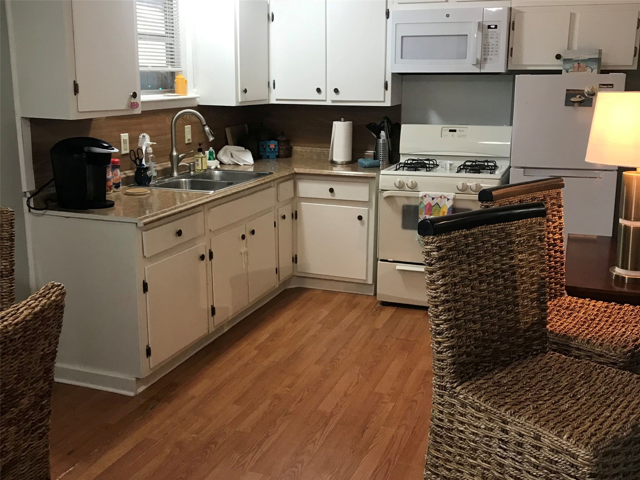 Charming kitchen in Annie's Song with ample storage, modern appliances, and cozy dining spaceperfect for culinary creativity and intimate meals.