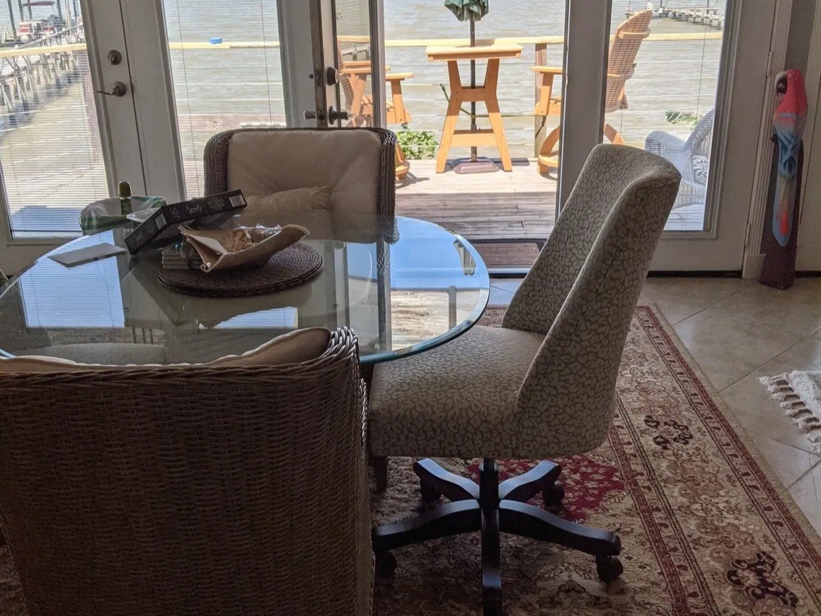 Enjoy stunning bay views from the elegant Bay Room, featuring a cozy dining area with direct access to a charming deck.