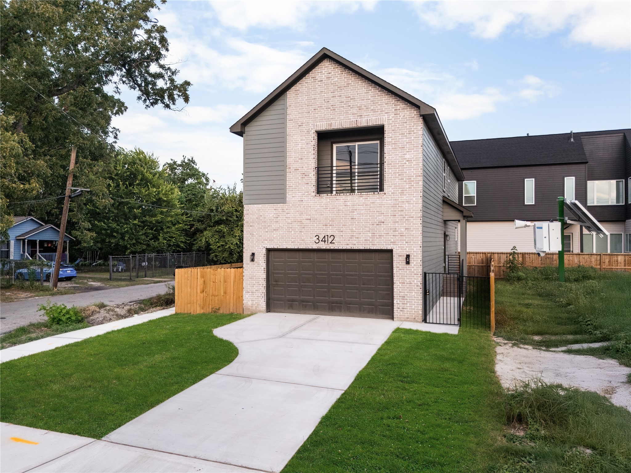 From the street, the home's thoughtful footprint comes into view: an attached two-car garage, a gated side
walkway leading to the covered entry, and wood privacy fencing framed by fresh new landscaping.