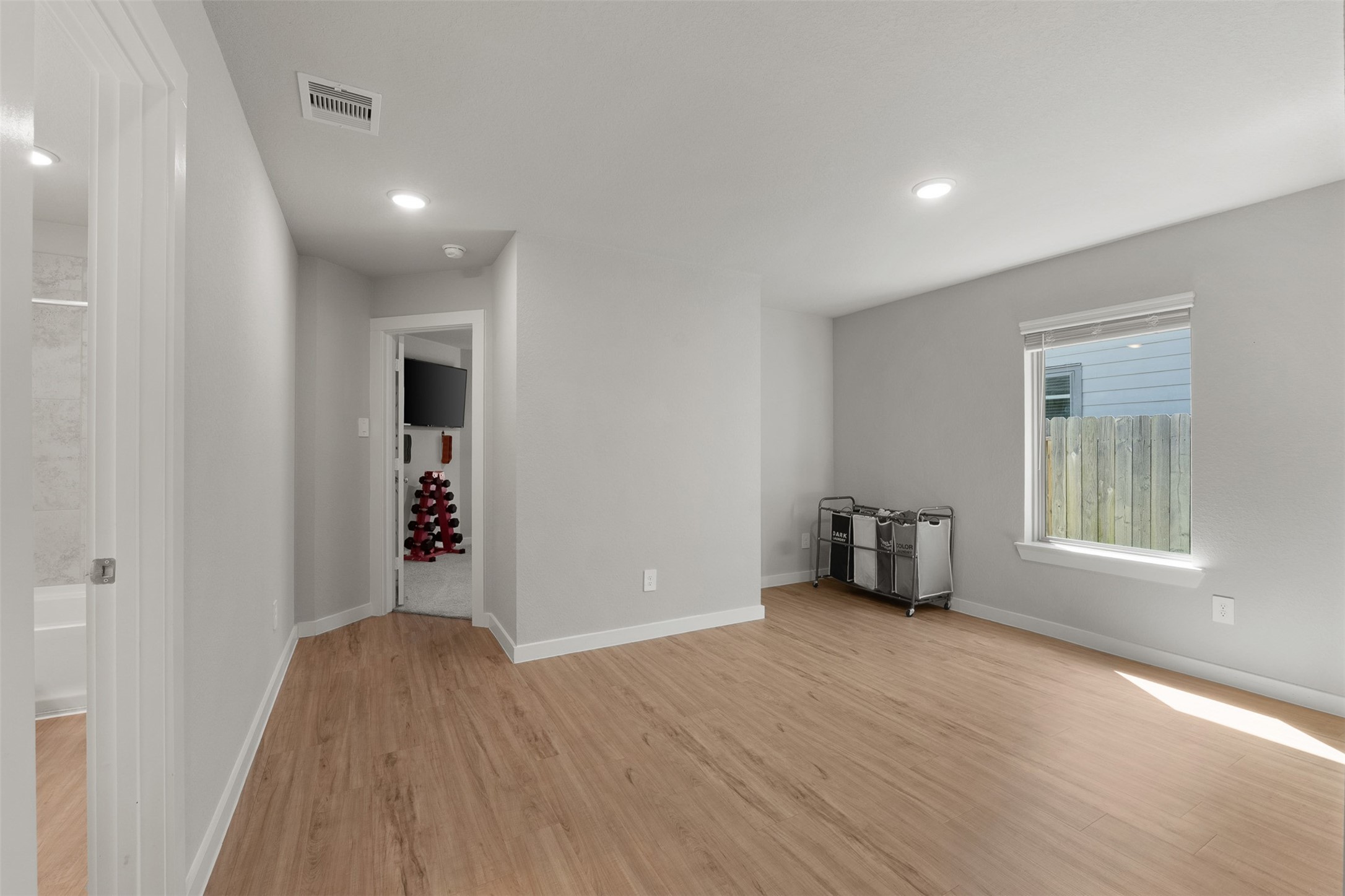This open space could be used for a game room space/ formal dining the possibilities are endless