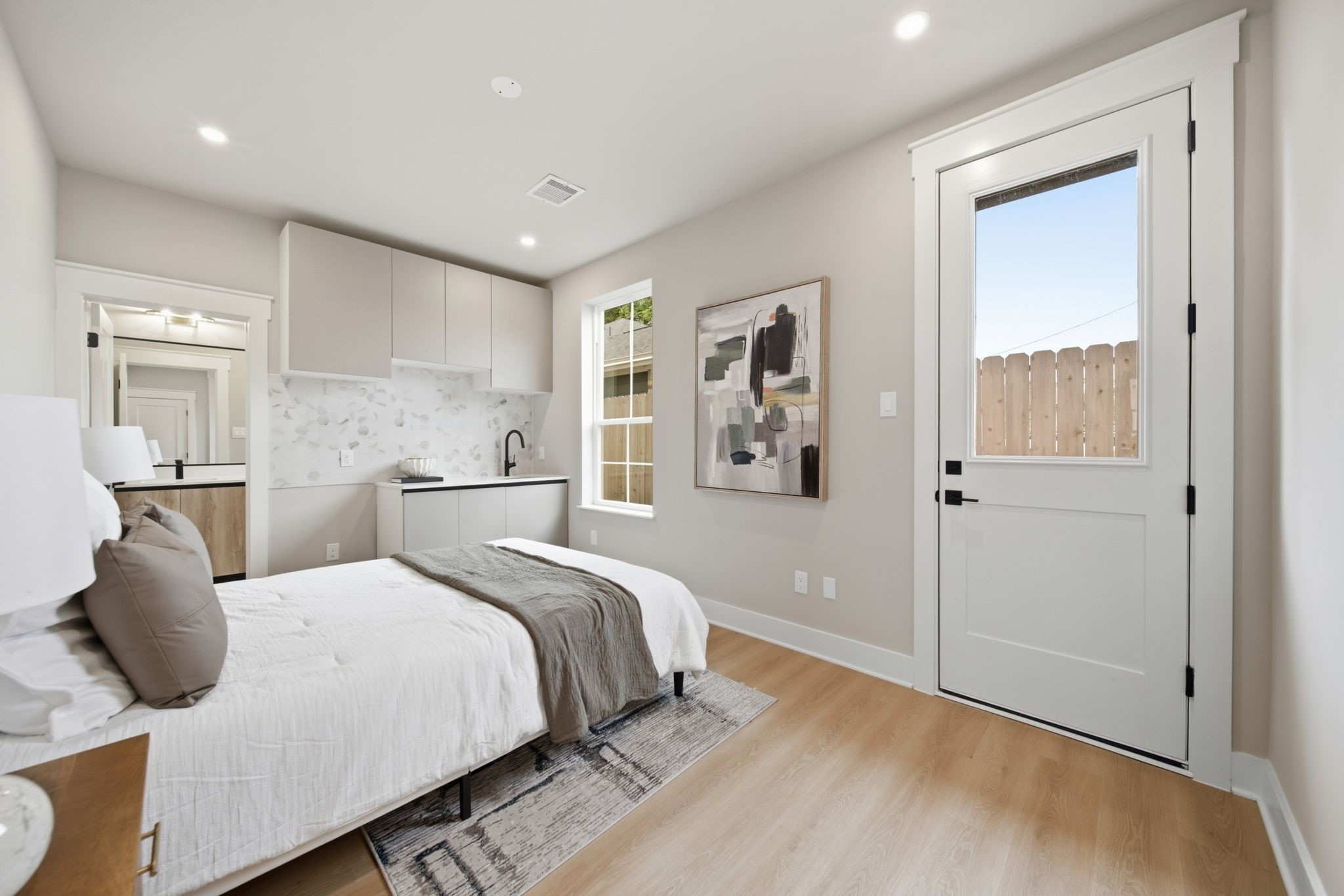 First floor bedroom is a guest suite fully equipped with a kitchenette, full bathroom, and a spacious closet.