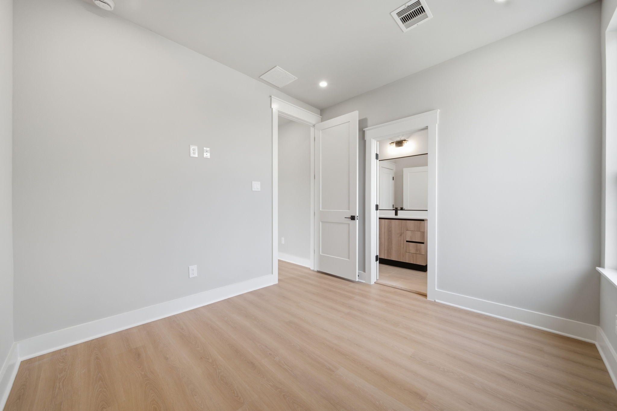 Another view of the secondary bedroom with a walk-in closet.