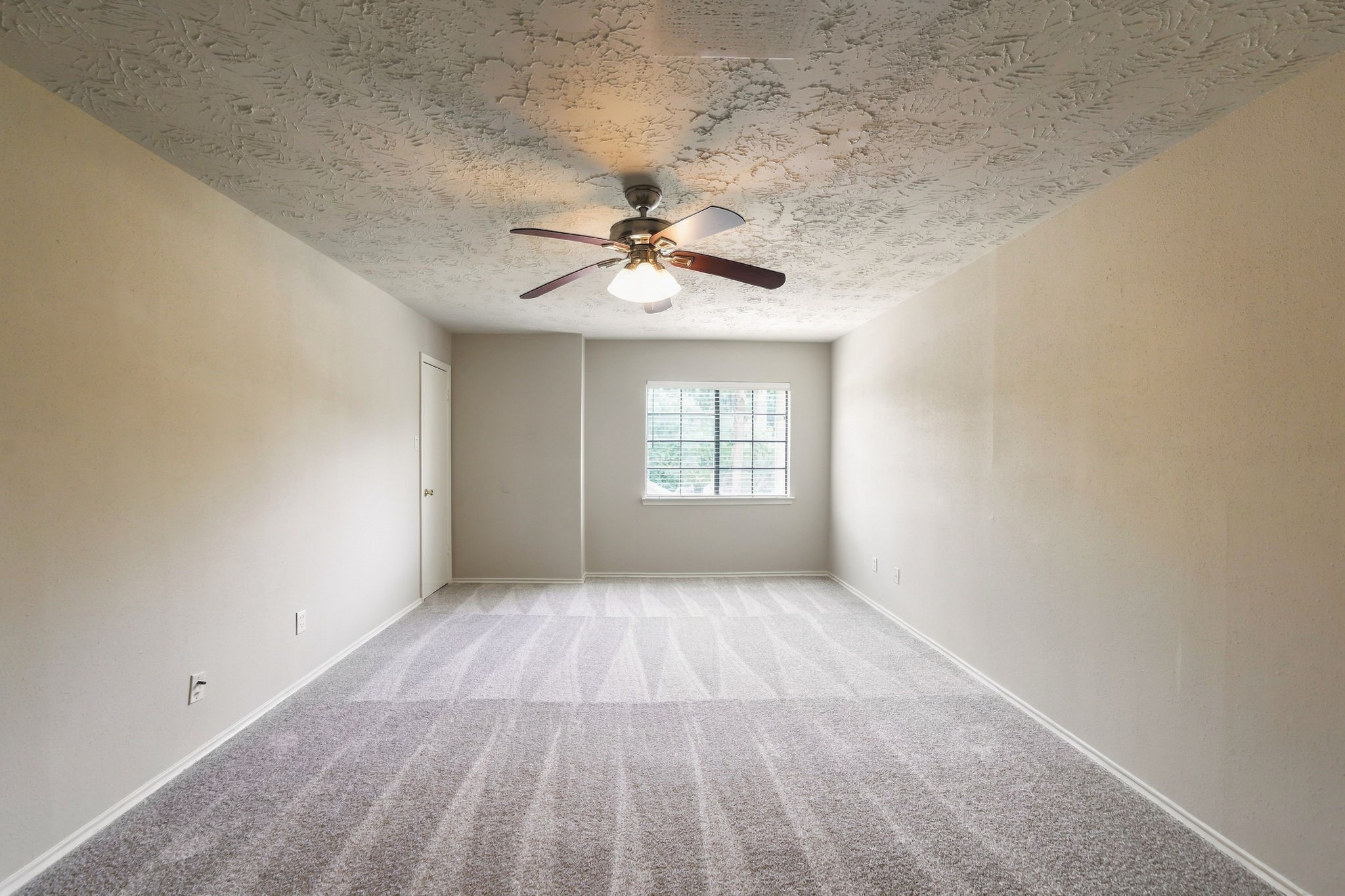 Another view of the primary bedroom