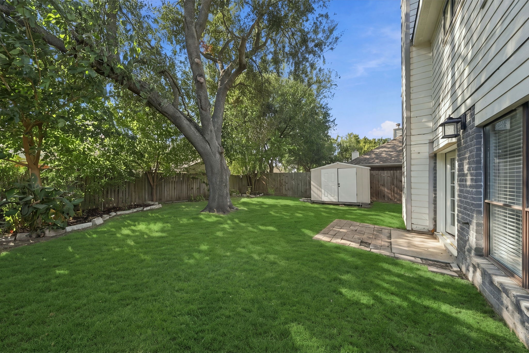 New landscaping and a shed for shorage.