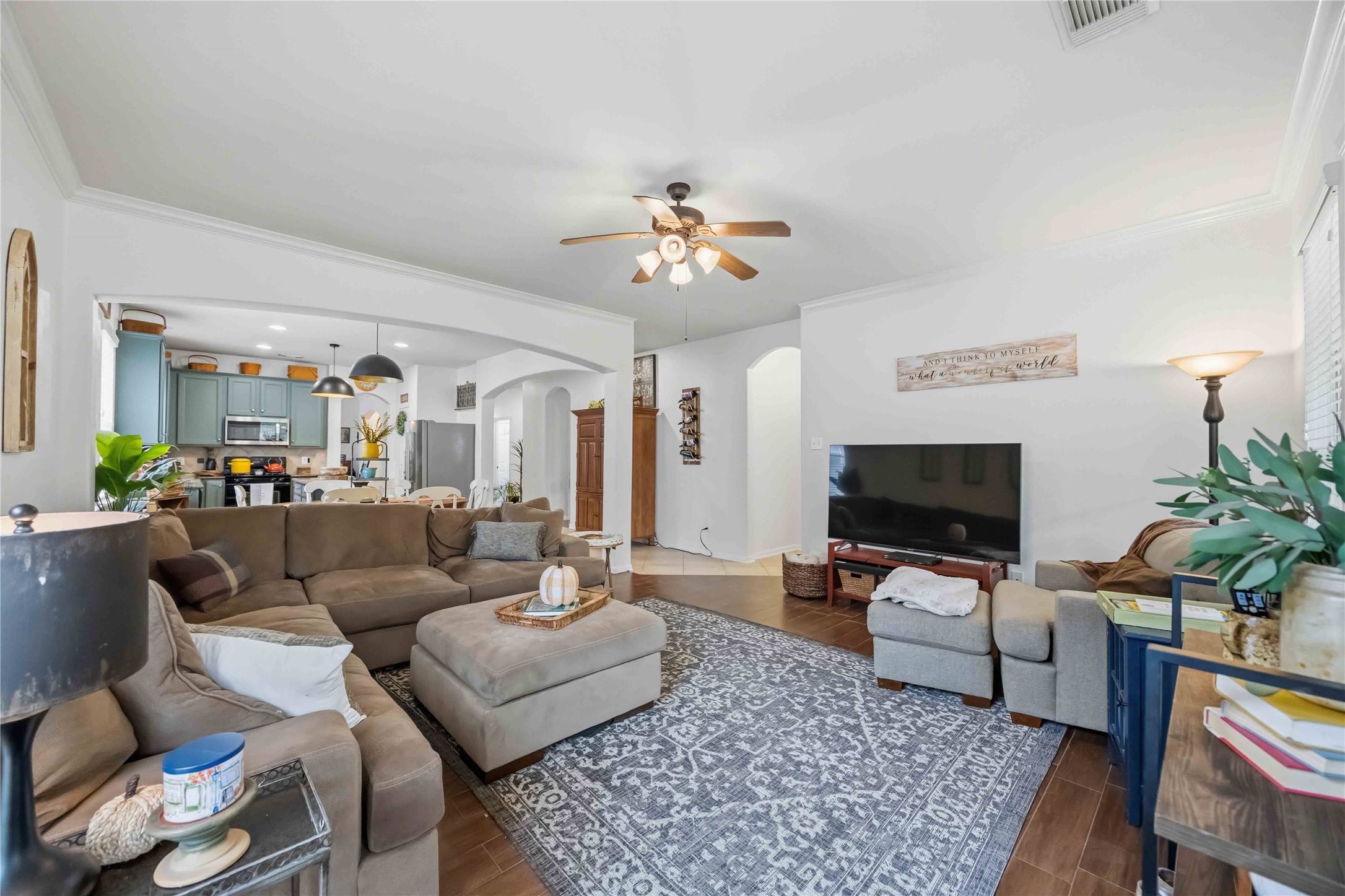 Open view of the family room showcasing its seamless connection to the breakfast area and kitchen.