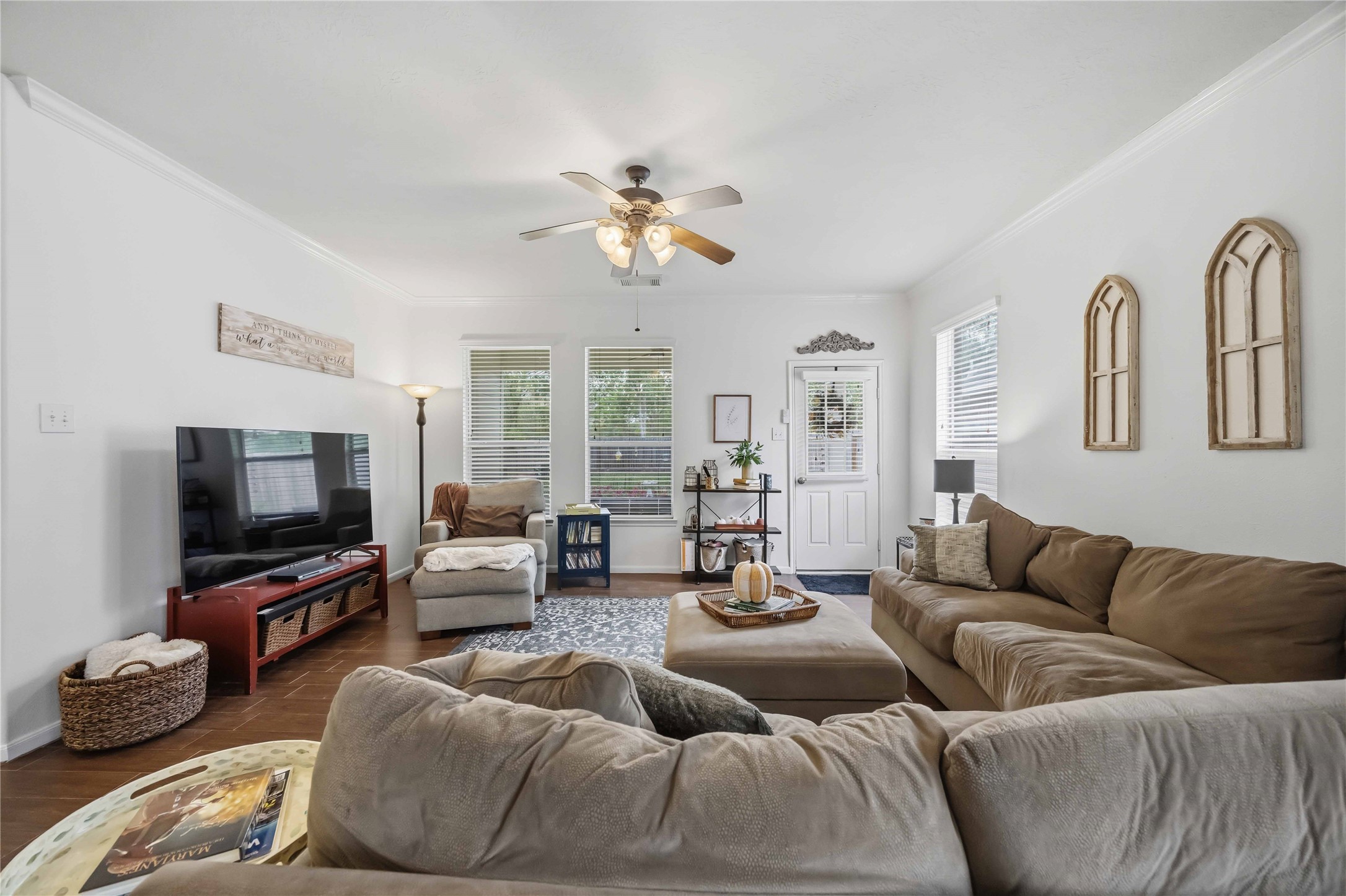 Another angle of the family room highlighting its generous layout and convenient access to the backyard.