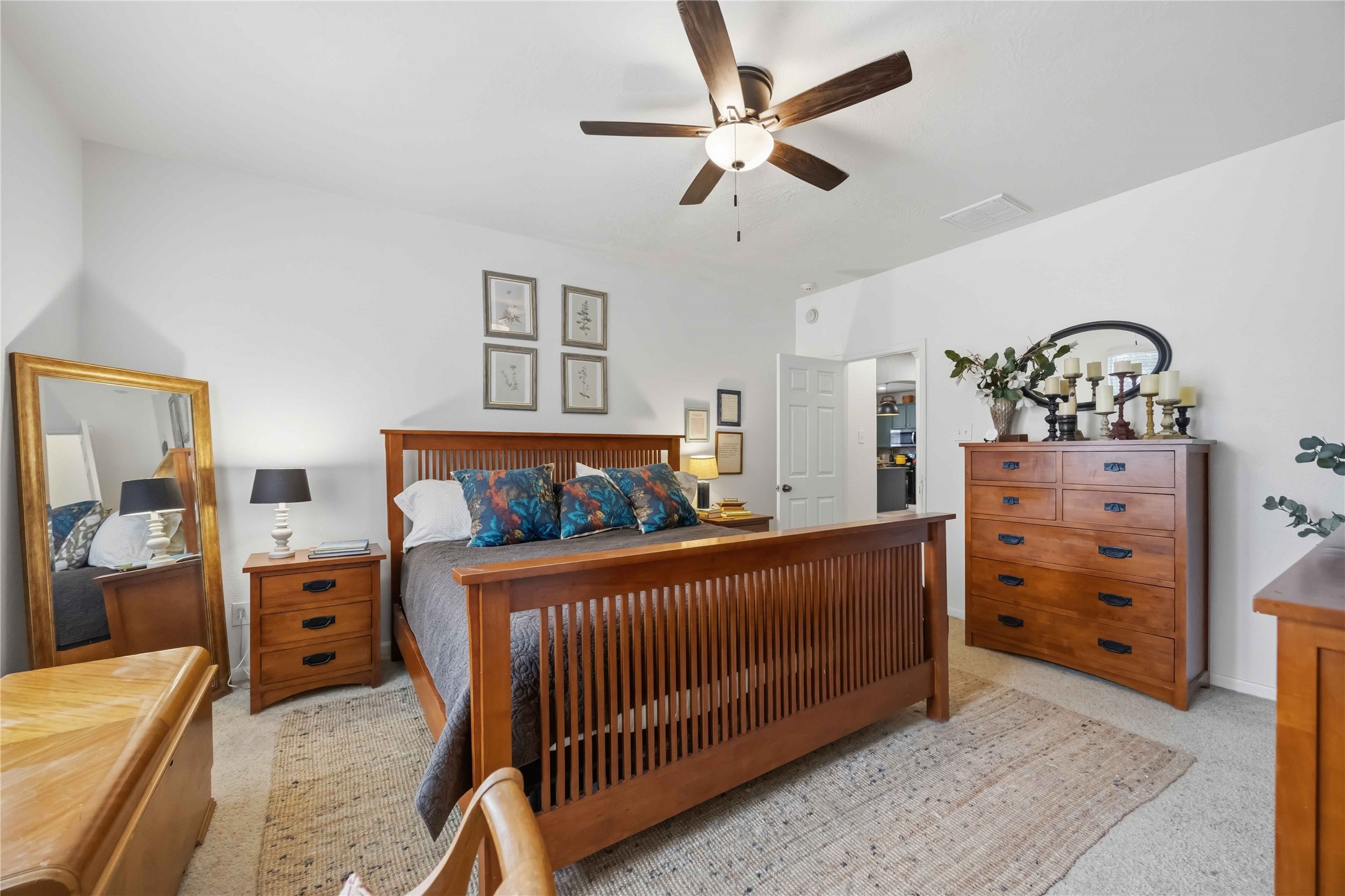Primary suite offers generous floor space, neutral finishes, and flexibility for different bedroom arrangements.