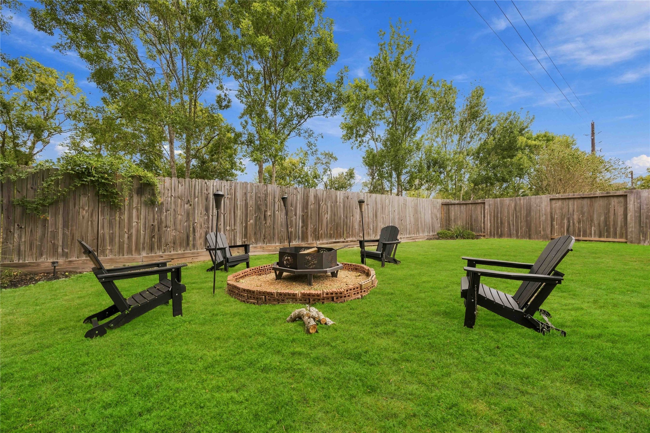 Dedicated fire pit area provides a great setting for outdoor gatherings and relaxing evenings.