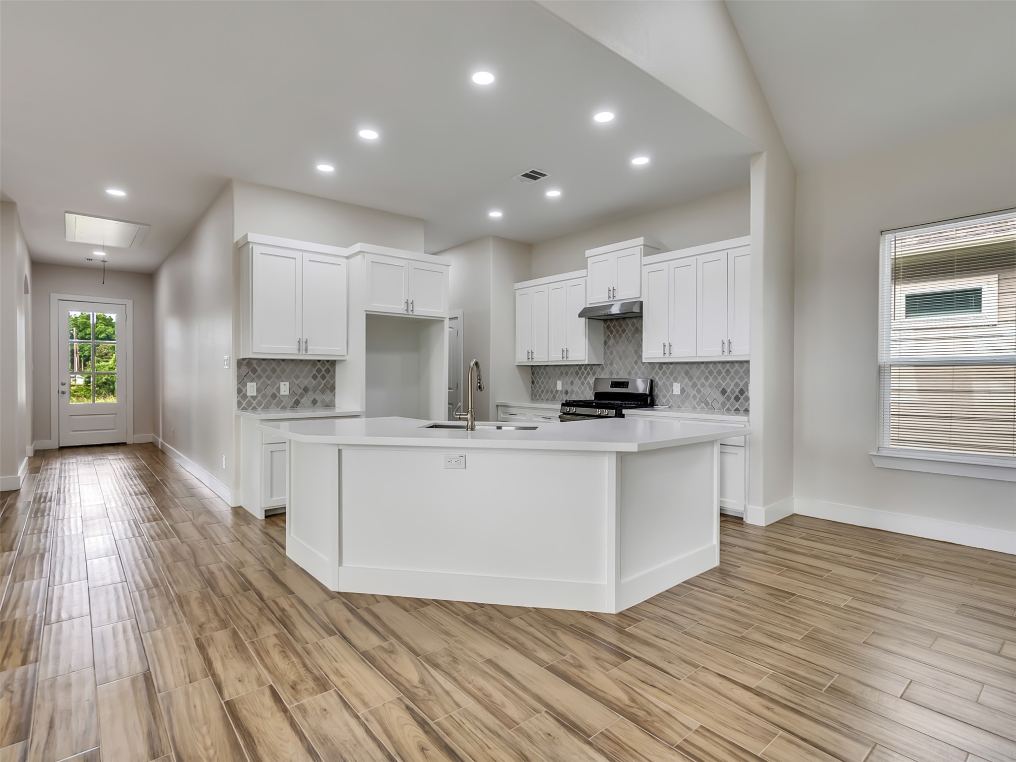 Spacious counters with quartz countertops.