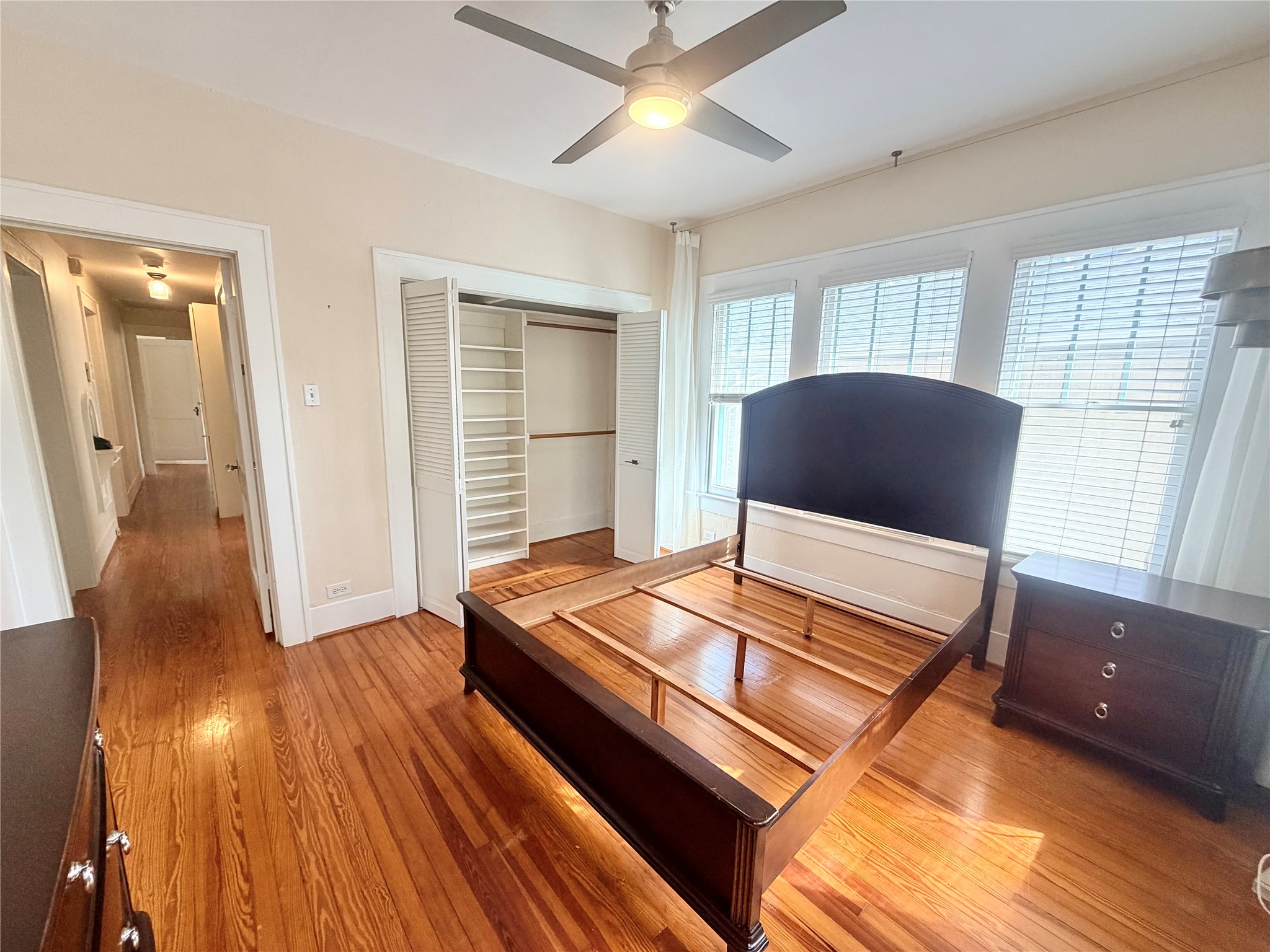 primary bedroom with spacious closet from back windows (furnishings can stay or be removed)