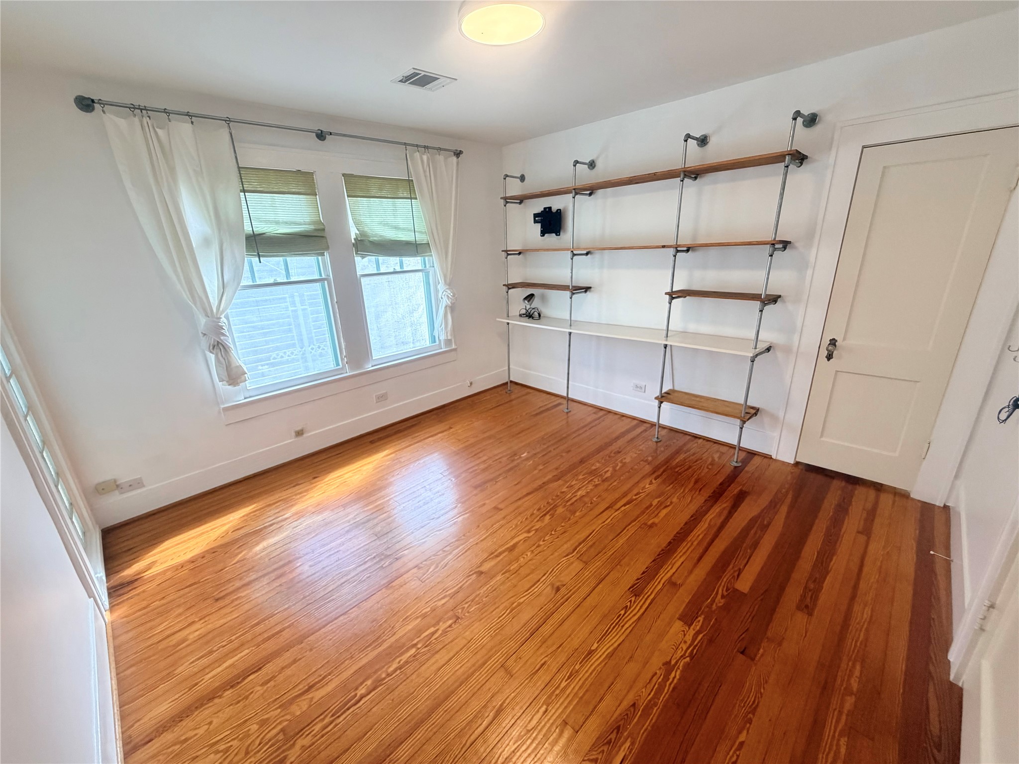 second bedroom with built in shelving