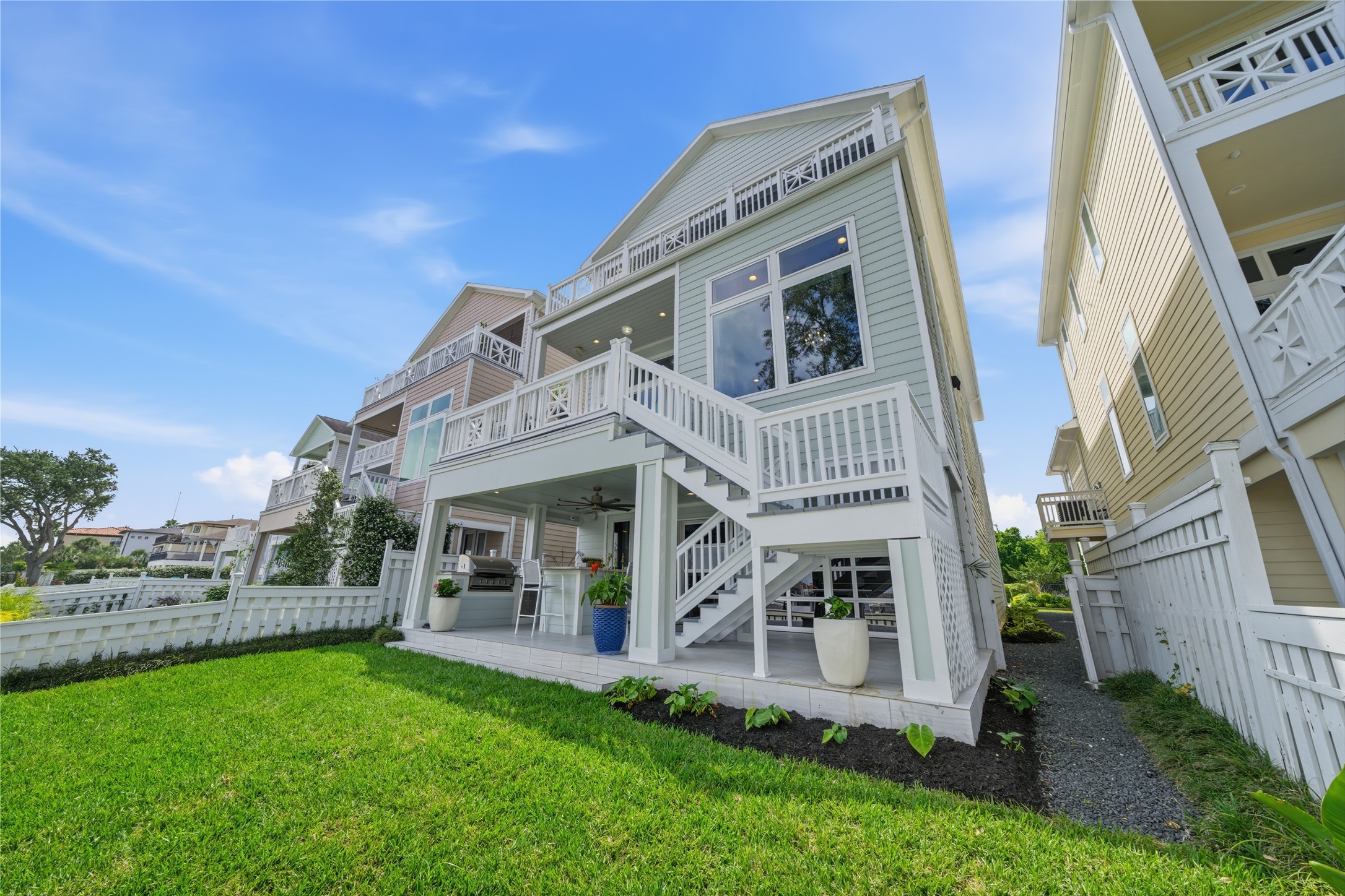 View of the back of the house with the 2 rear balconies.