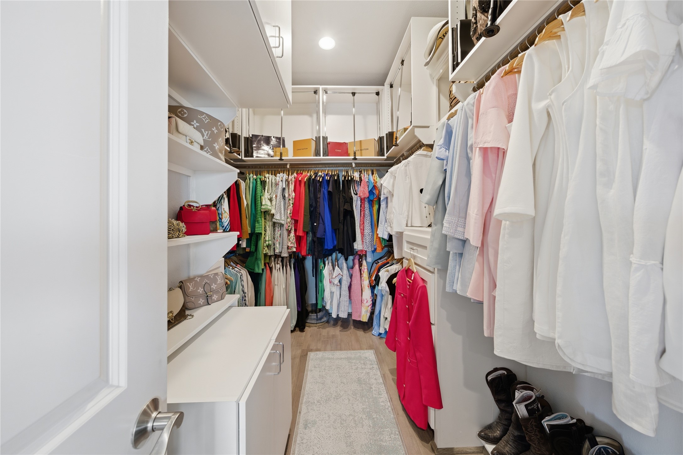 Large primary closet with a pull-down closet rod.  Perfect for your seasonal clothing rotation.
