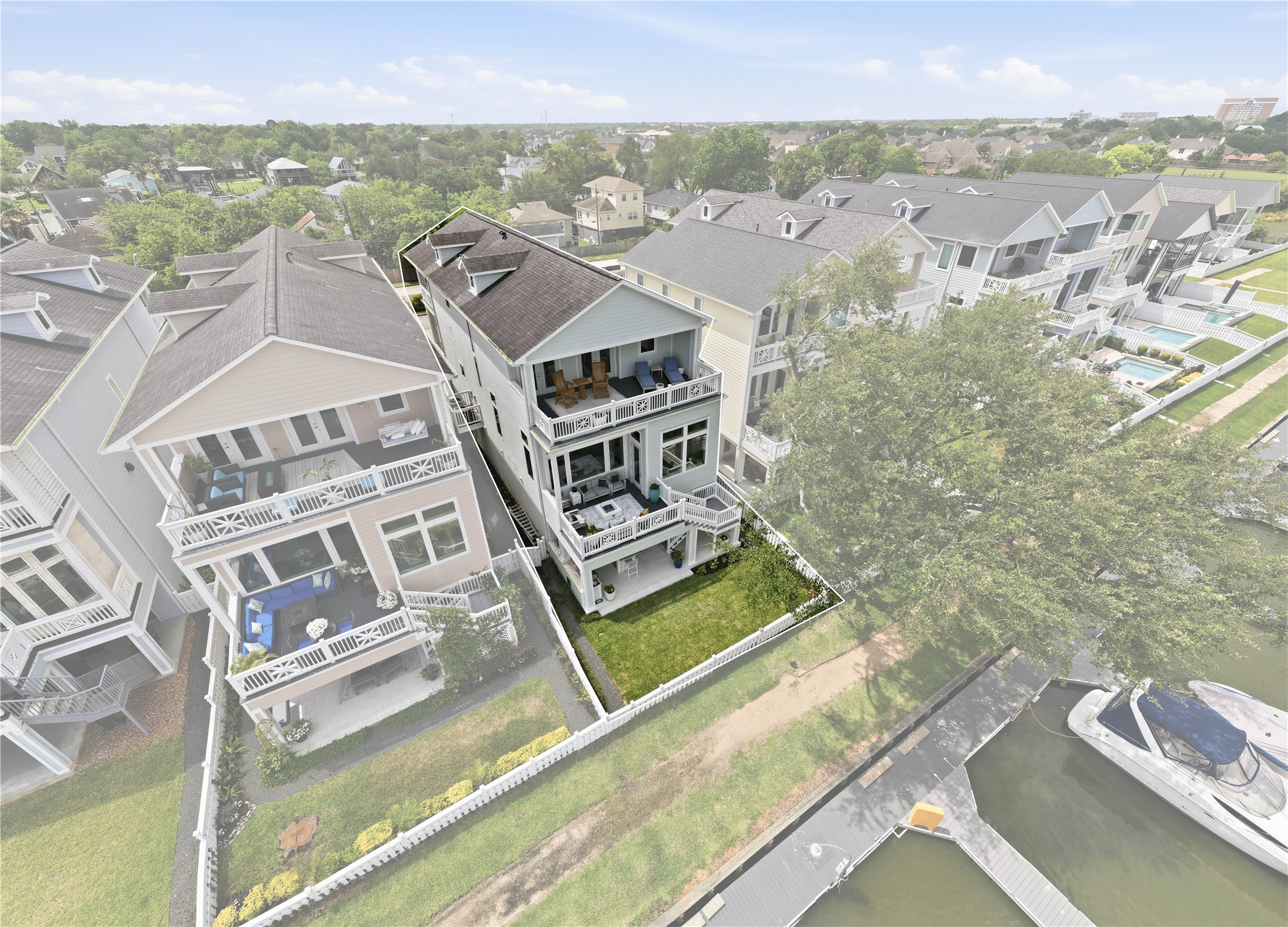 Welcome to waterfront living! Backyard complete with white picket fence and gate onto the Marina walking path. Welcome to waterfront living! Backyard complete with white picket fence and gate onto the Marina walking path.