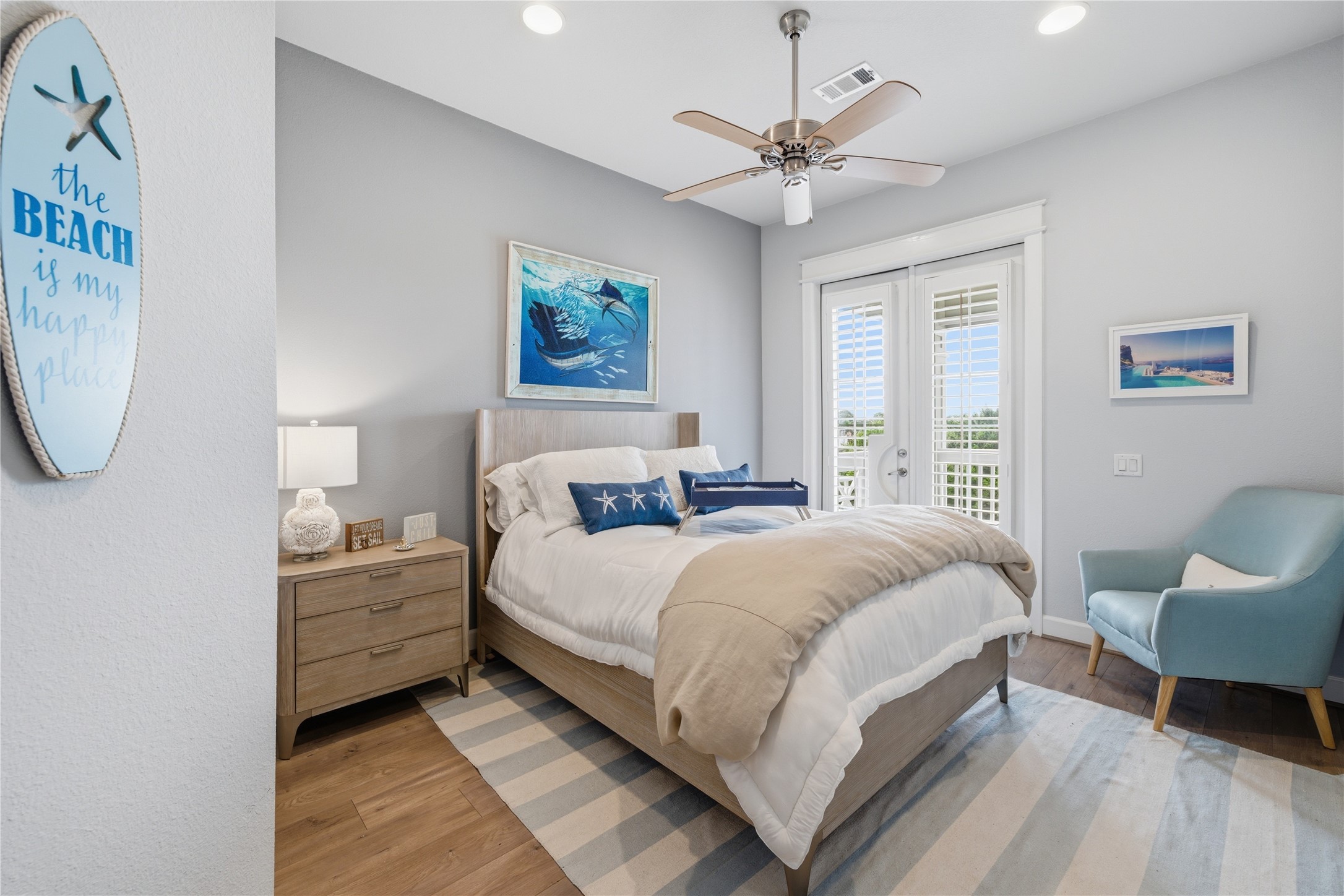 Bedroom #2, with french doors to the front balcony.