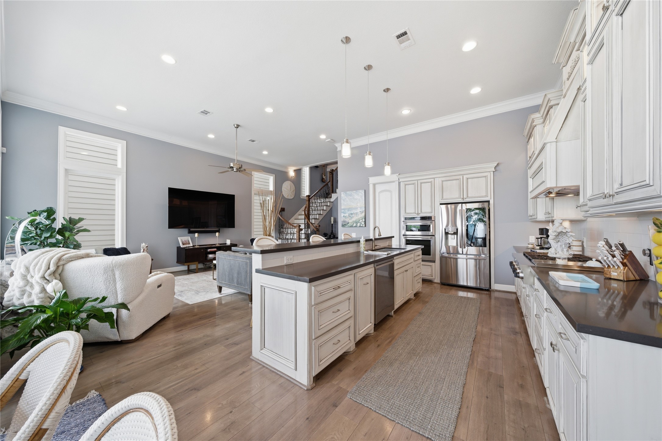 A view of the family room and kitchen from the breakfast room.