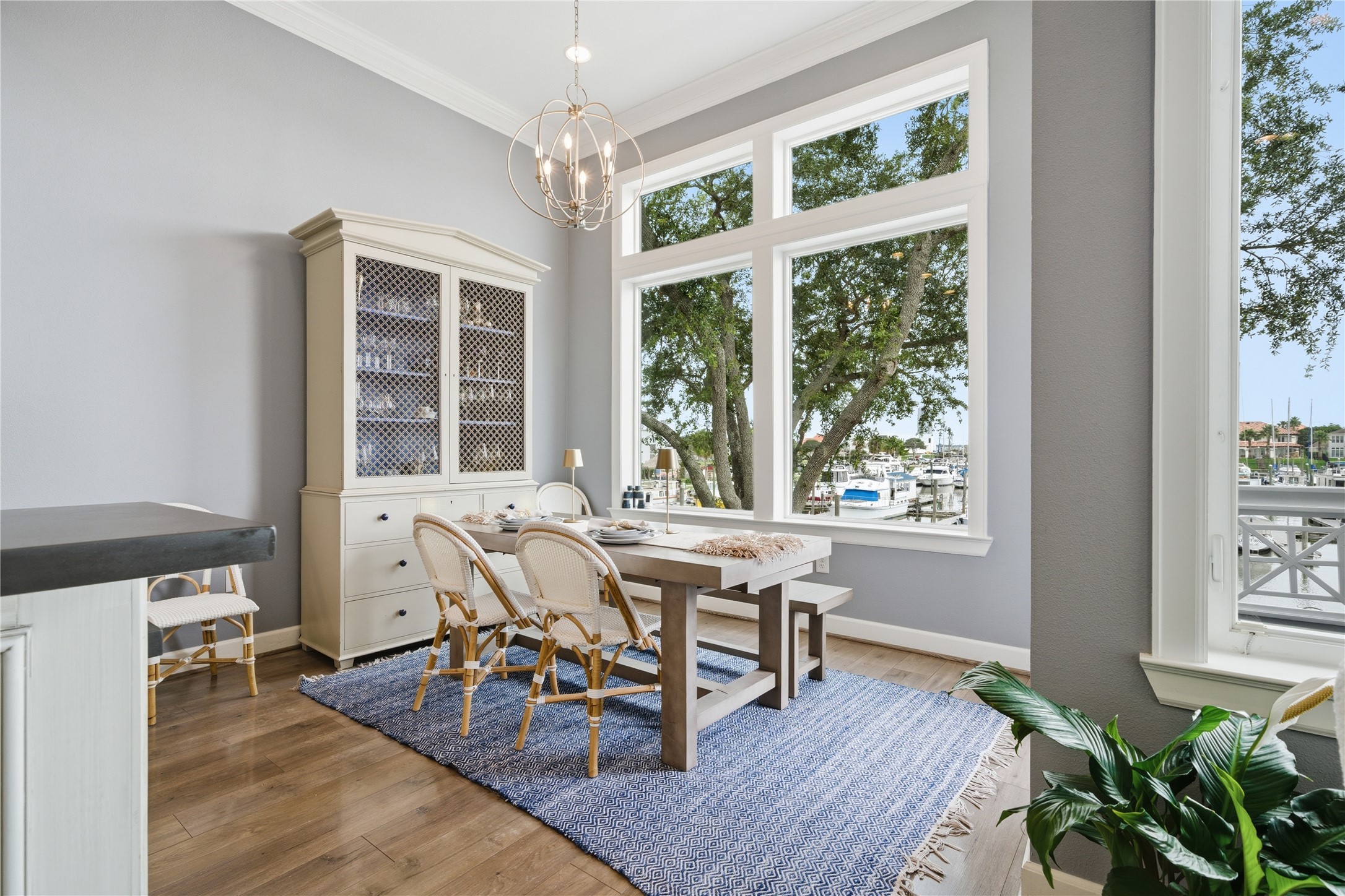 The breakfast room is located off of the kitchen and has a door to the back balcony.