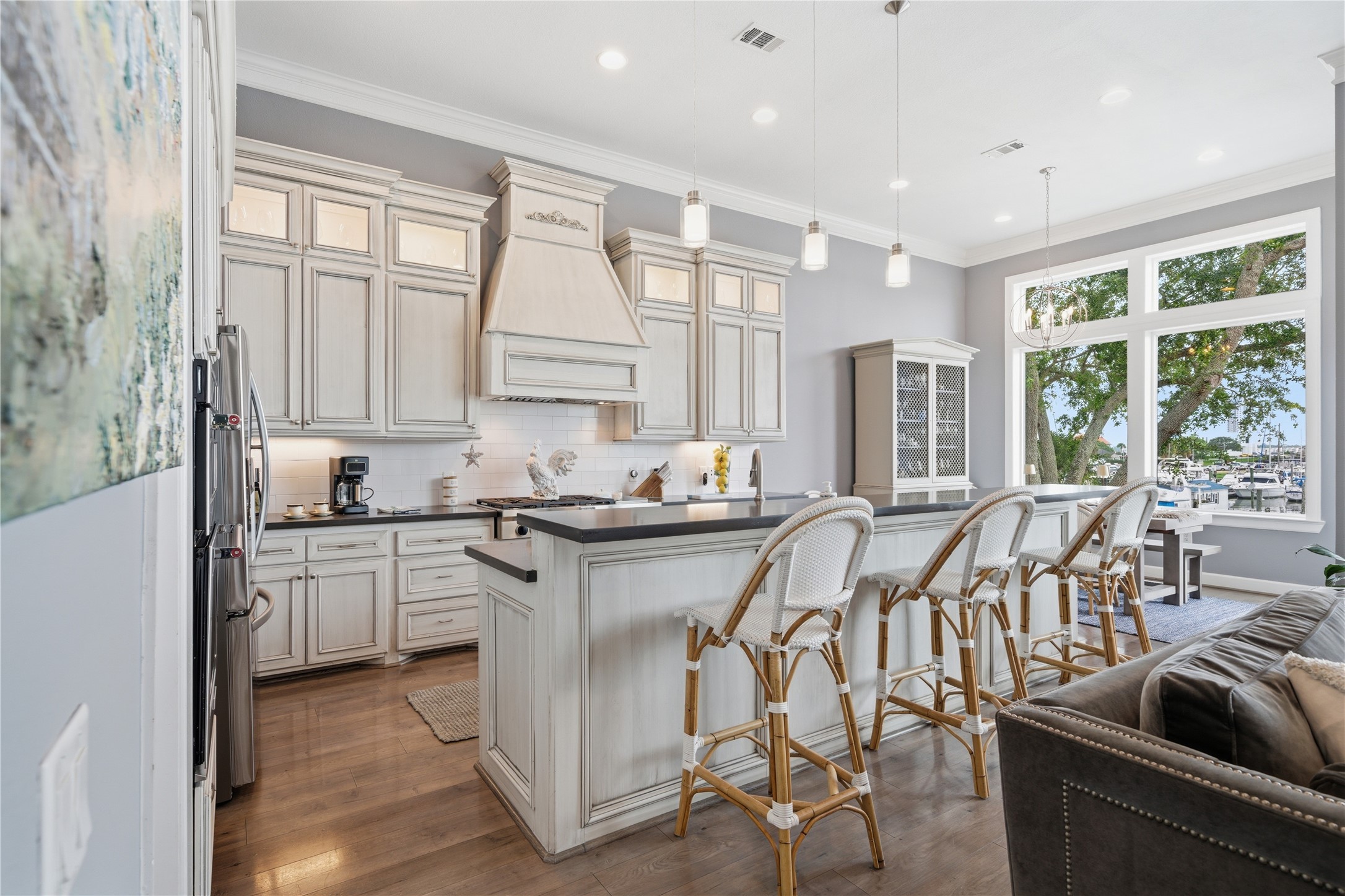 The kitchen is open to the family room, complete with bar seating and under-cabinet lighting.