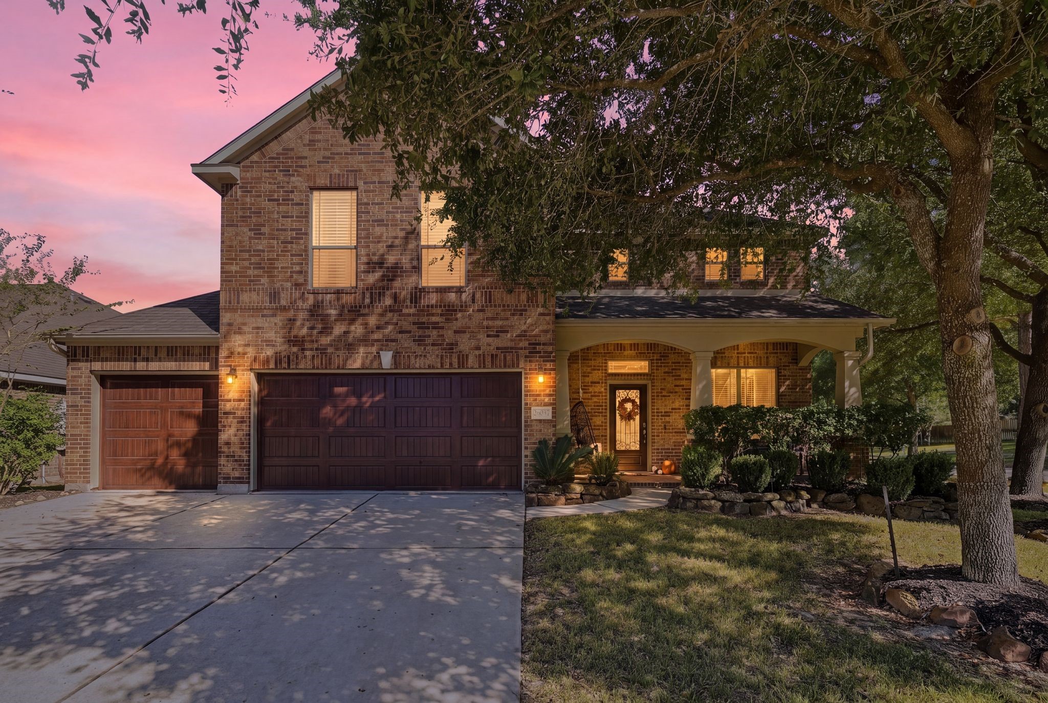 Stunning brick home with charming covered porch, nestled amidst mature trees and enhanced by a beautifully landscaped front yard. Stunning brick home with charming covered porch, nestled amidst mature trees and enhanced by a beautifully landscaped front yard.