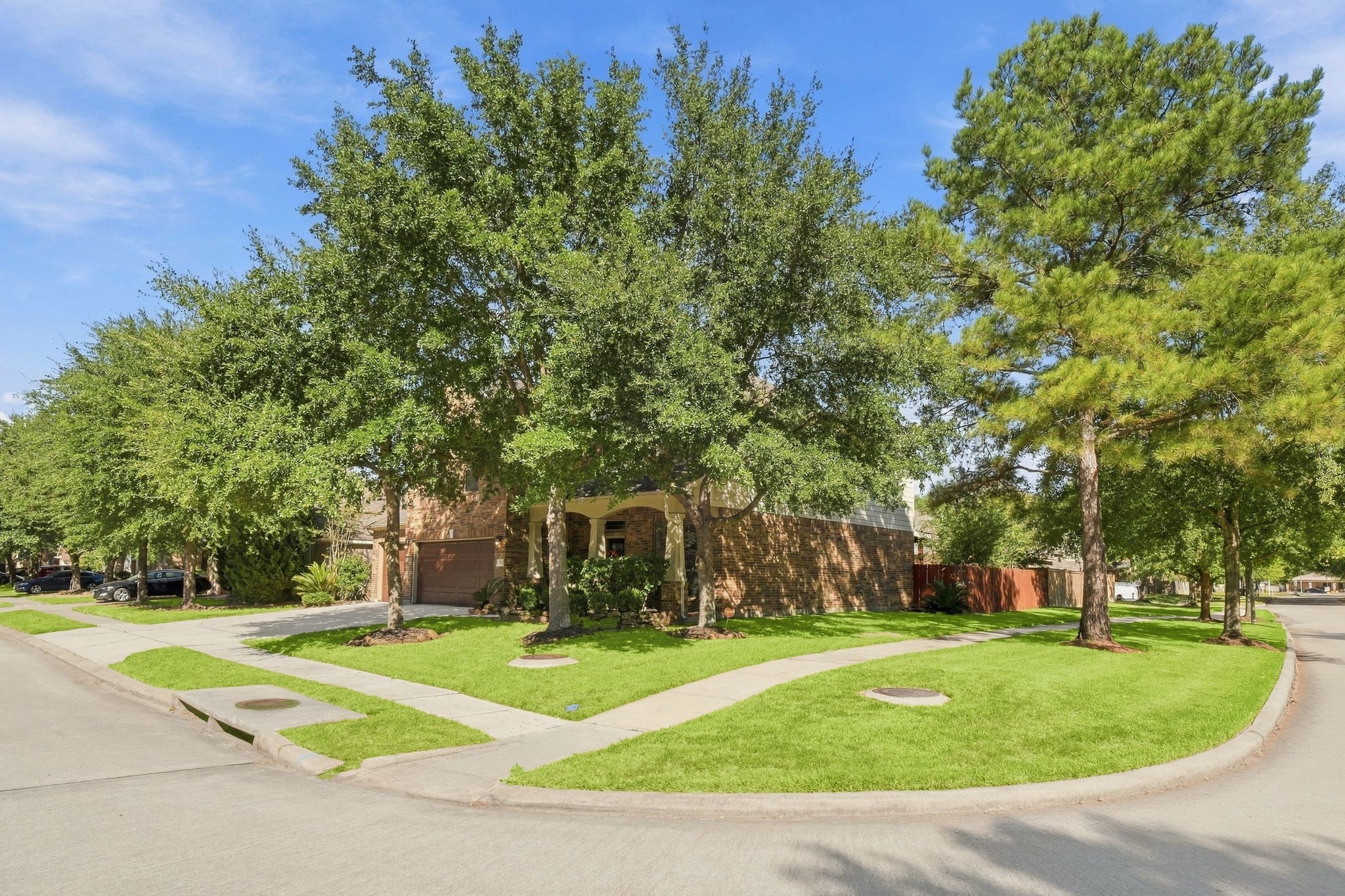 Charming corner lot home with lush landscaping and mature trees, offering great curb appeal and a welcoming entrance. Charming corner lot home with lush landscaping and mature trees, offering great curb appeal and a welcoming entrance.