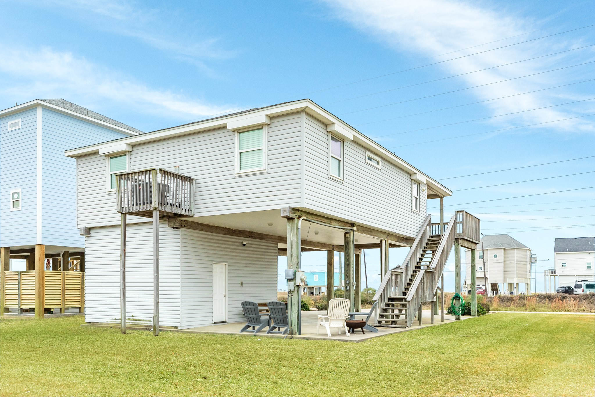 Rear view o home, all windows have roll down shutters.