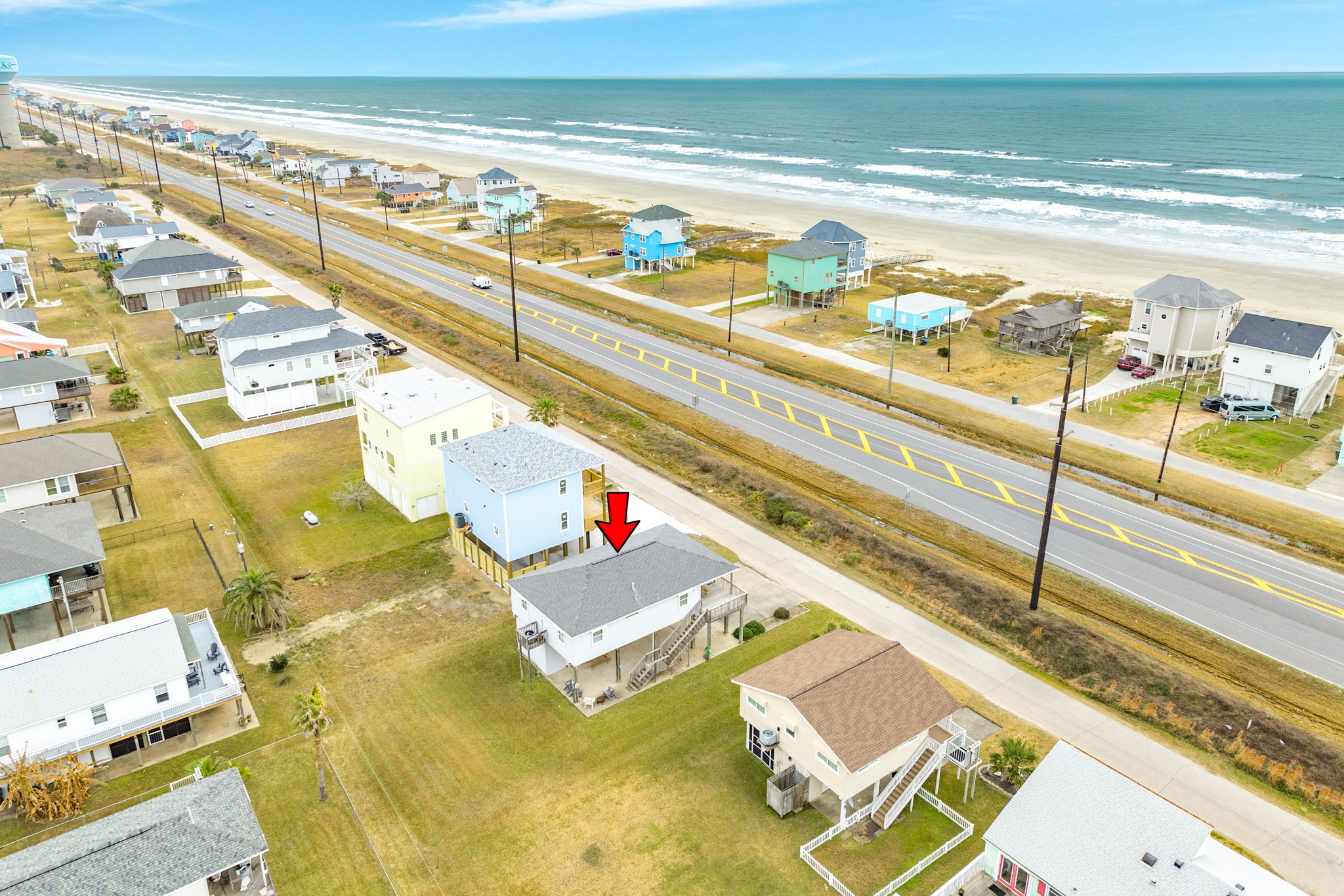 Aerial view of home & beach looking to the SE.