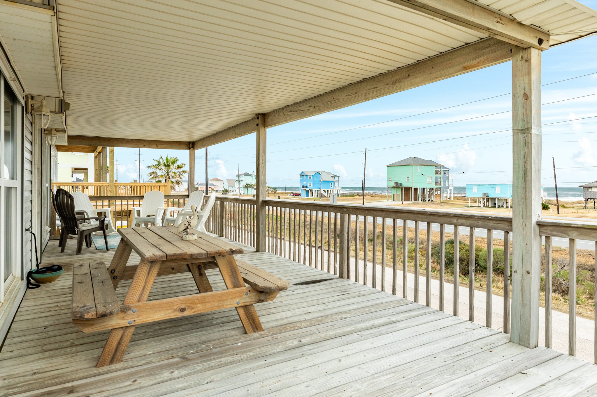 Sit back and enjoy the sounds of the Gulf and cool breezes on your covered front deck Sit back and enjoy the sounds of the Gulf and cool breezes on your covered front deck