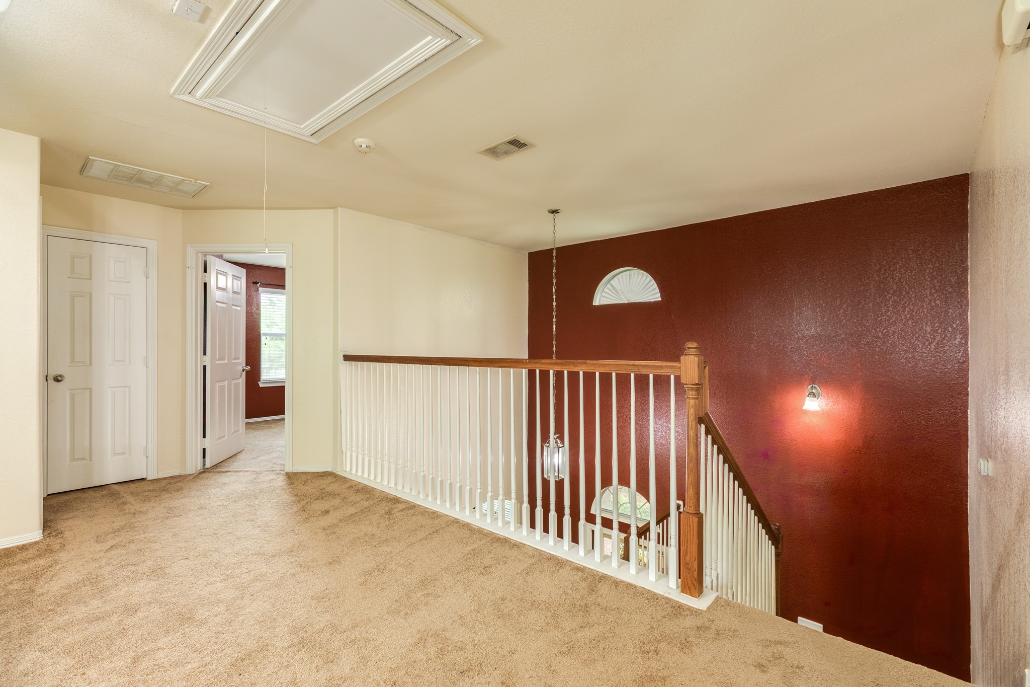 Two story entry way opens up to the upstairs second living room.