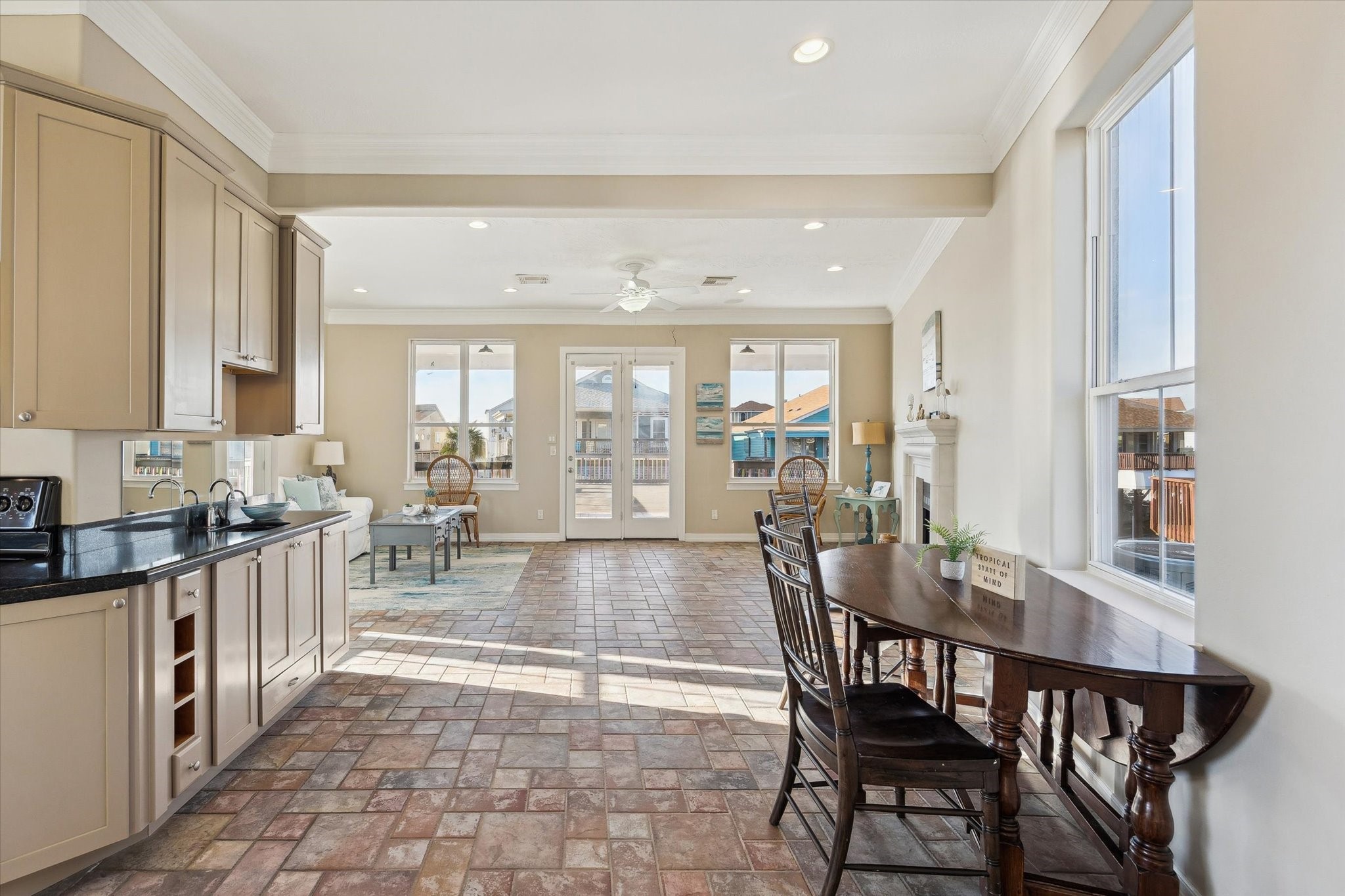 Kitchen to dining to family room and onto entertaining patio Kitchen to dining to family room and onto entertaining patio