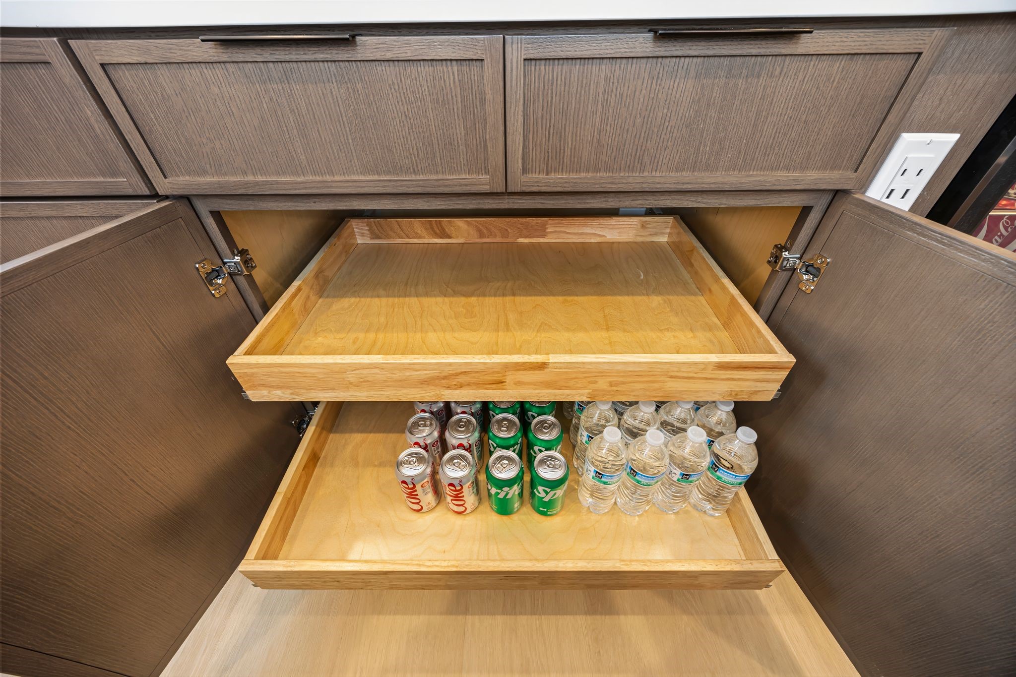 Experience seamless organization in this kitchen with its sleek pull-out shelving, perfect for easy access to your essentials. **Model Home of similar layout & finishes.**