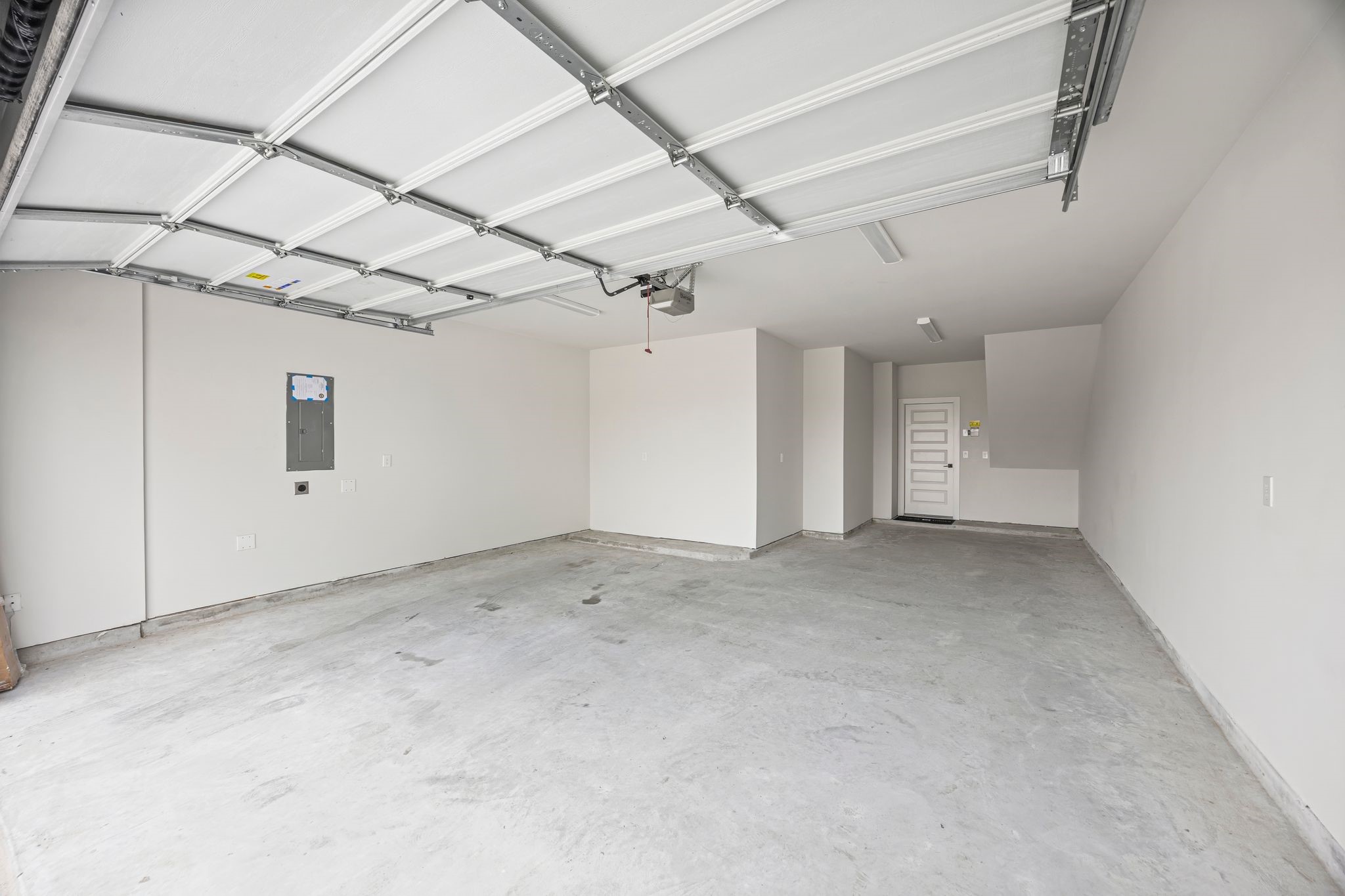 Expansive and versatile, this 3-car garage offers ample space for vehicles and storage, enhancing both convenience and functionality for modern living. **Model Home of similar layout & finishes.**