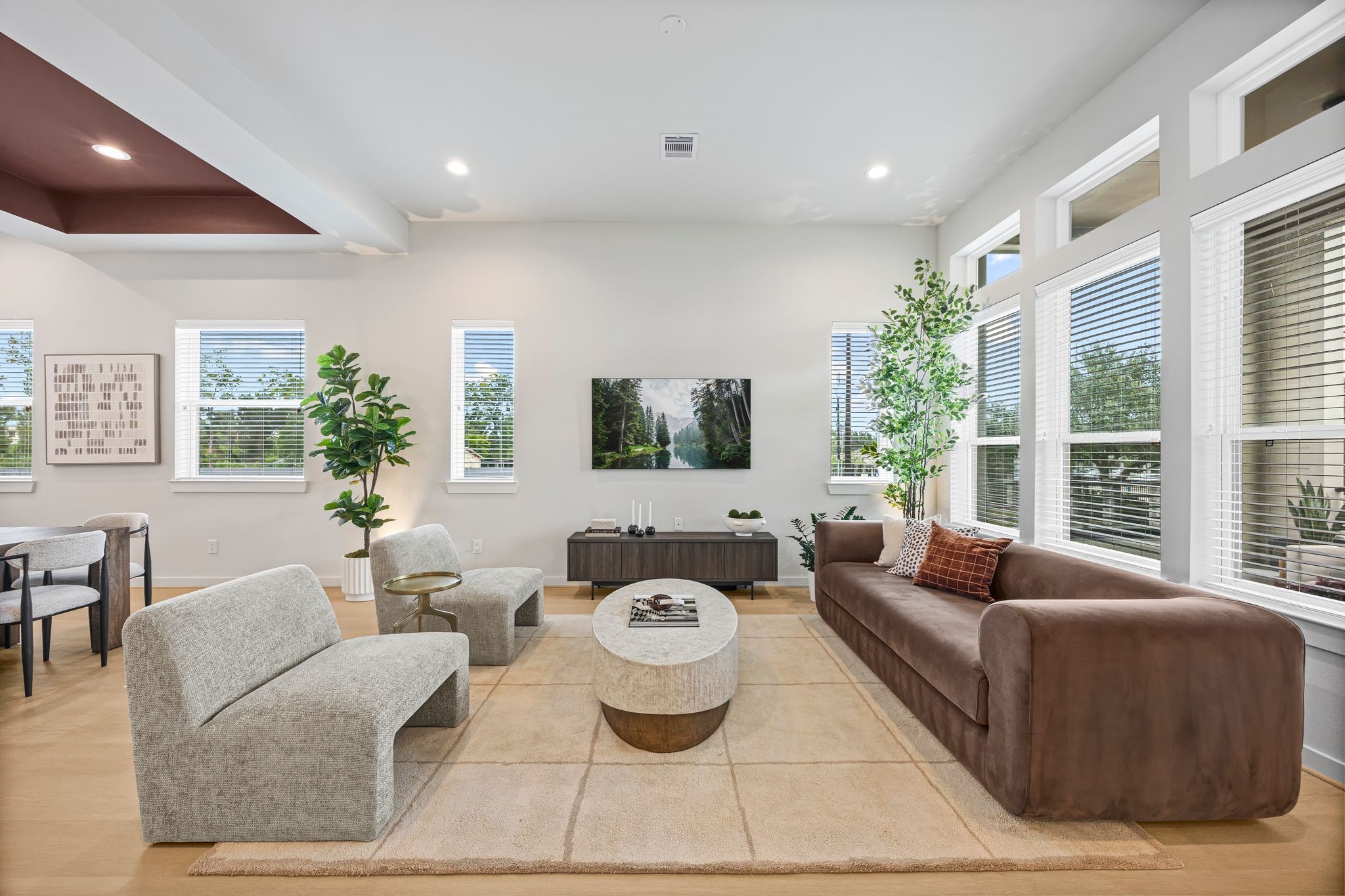 Bright and inviting, this living area is a perfect blend of modern elegance and comfort, featuring ample natural light, plush seating, and stylish decor for a welcoming atmosphere. **Model Home of similar layout & finishes.**