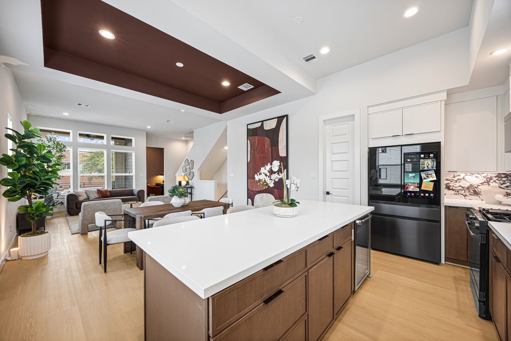 Discover the seamless blend of modern elegance and functionality in this open-concept space, where the sleek kitchen flows effortlessly into the inviting dining and living areas, perfect for entertaining and everyday living. **Model Home of similar layout & finishes.**
