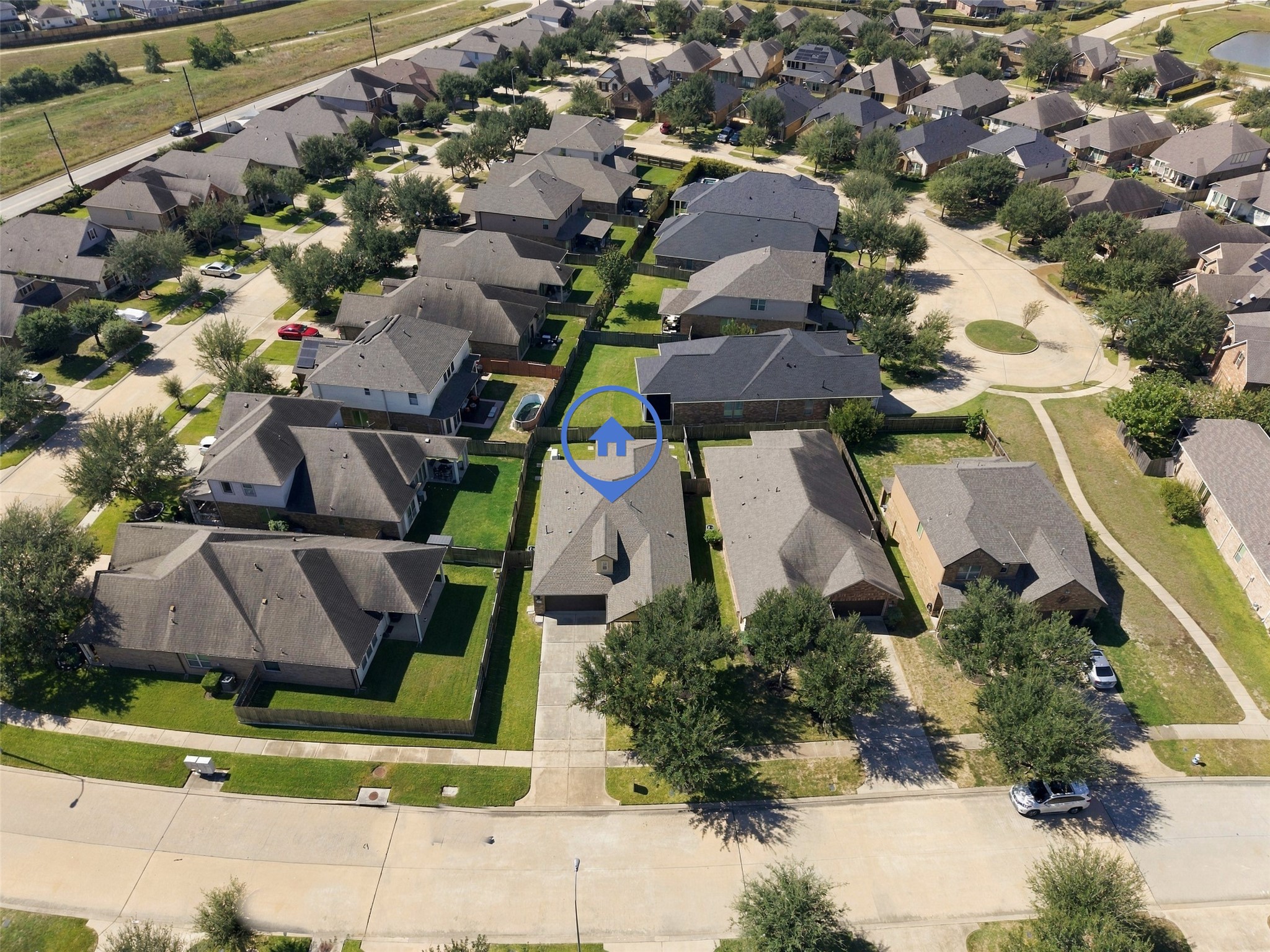 The aerial view showcases the property and community.