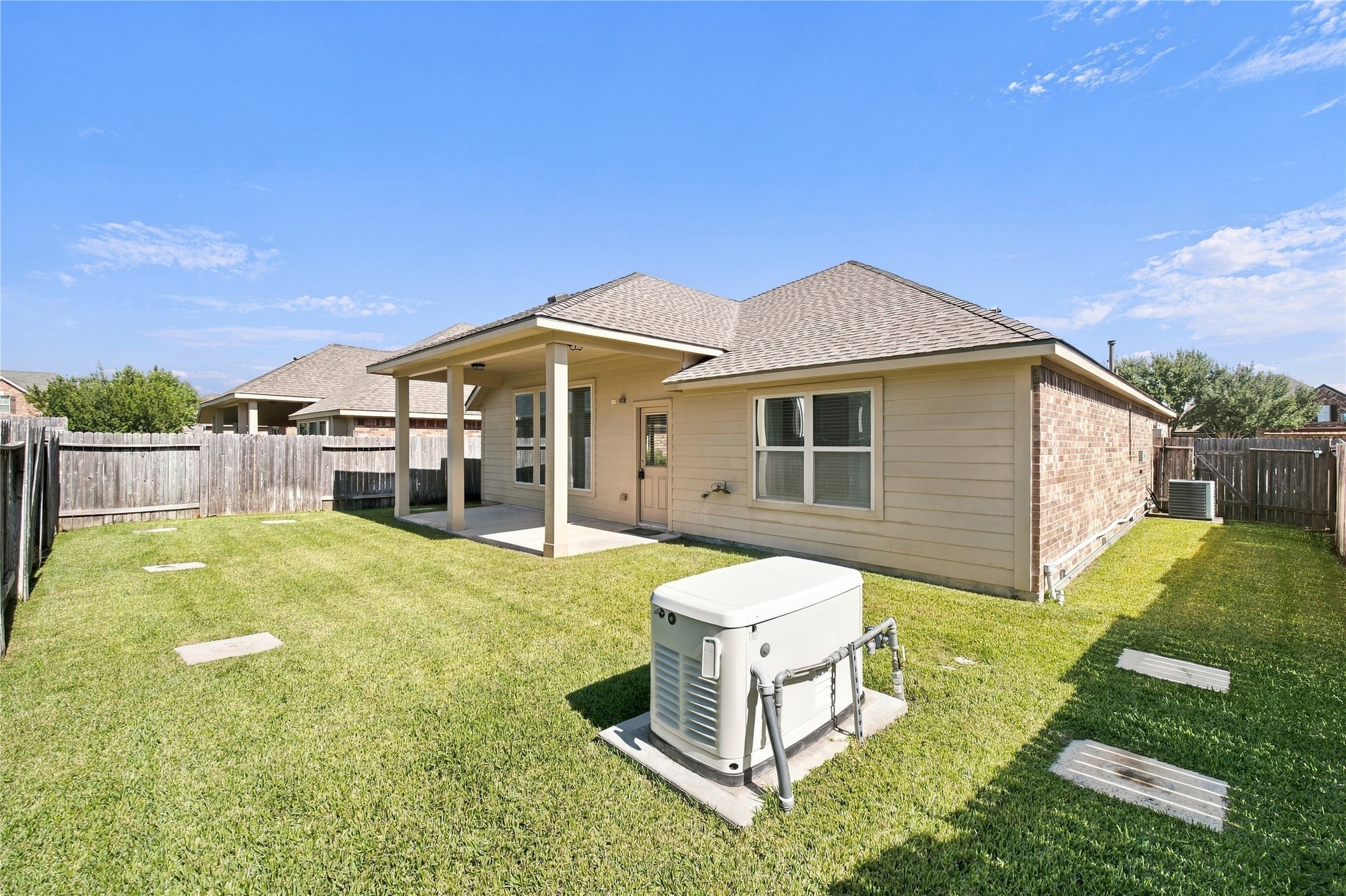 The backyard offers space for outdoor play, gardening, and enjoying time outside.