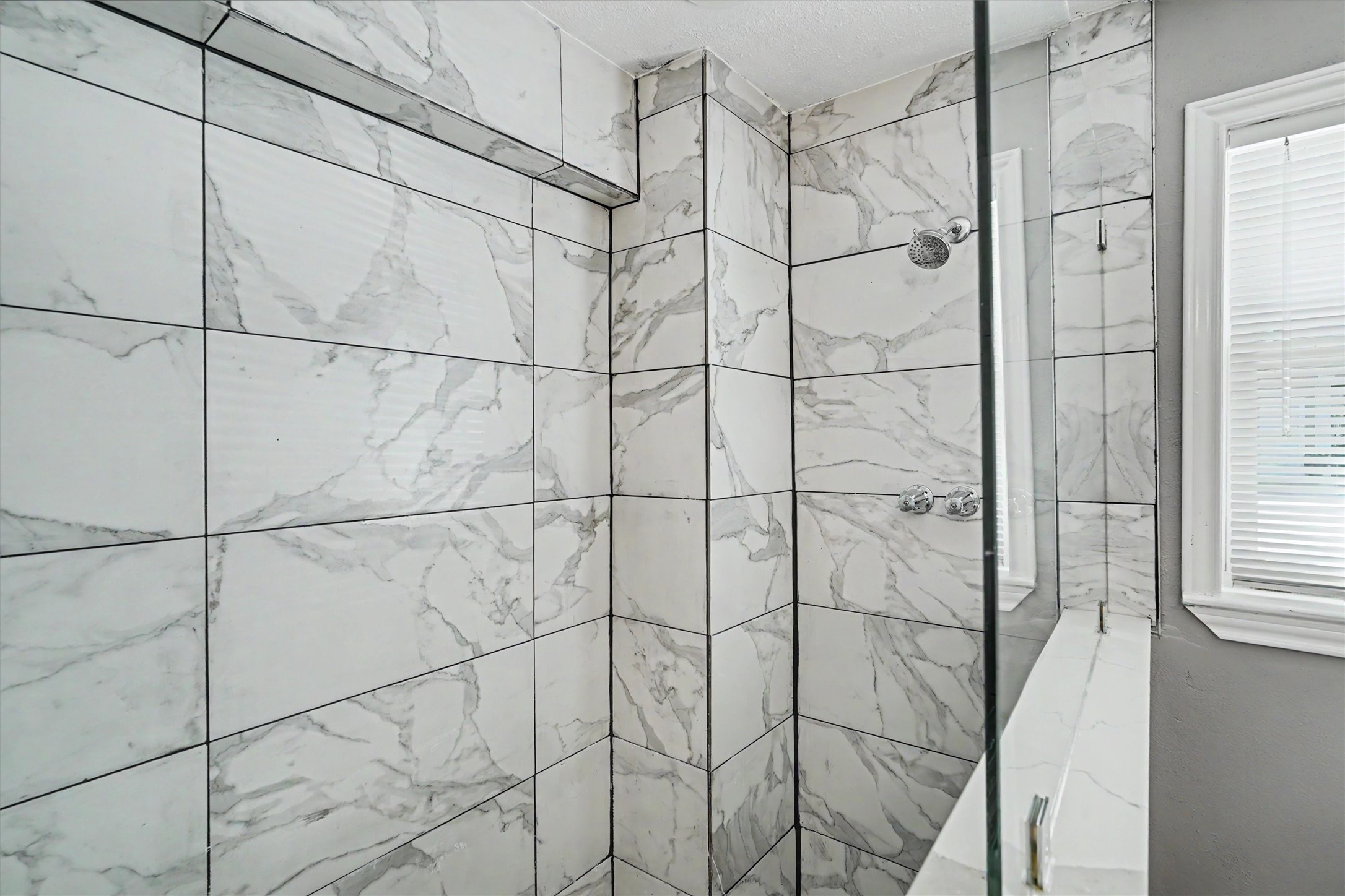 Custom tiled oversized walk in shower downstairs. Perfect after fishing days!