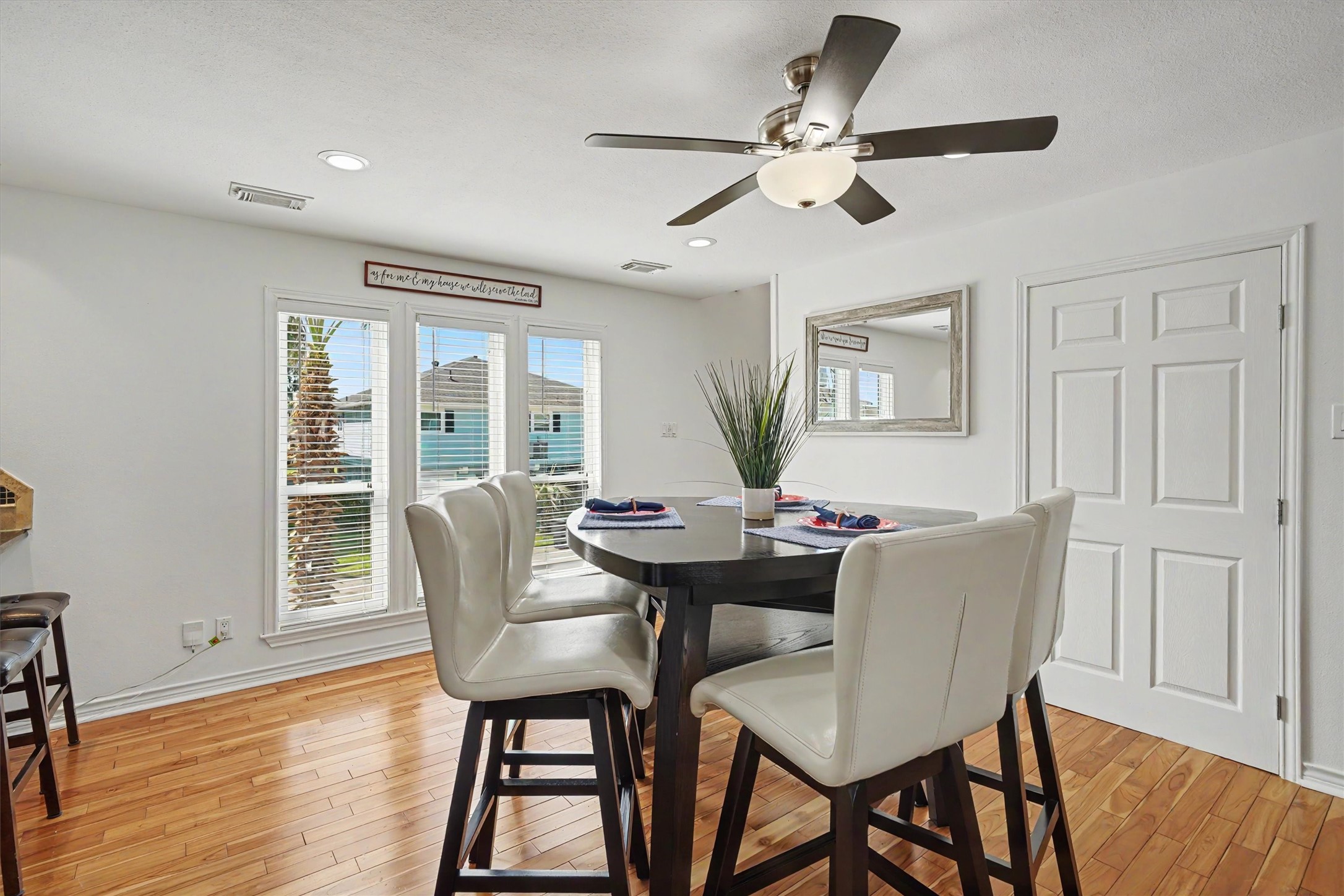 Dining room with windows allowing in plenty of natural lighting